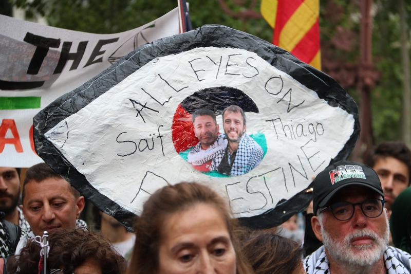 A banner in support of the two kidnapped activists during the protest on Saturday, May 2