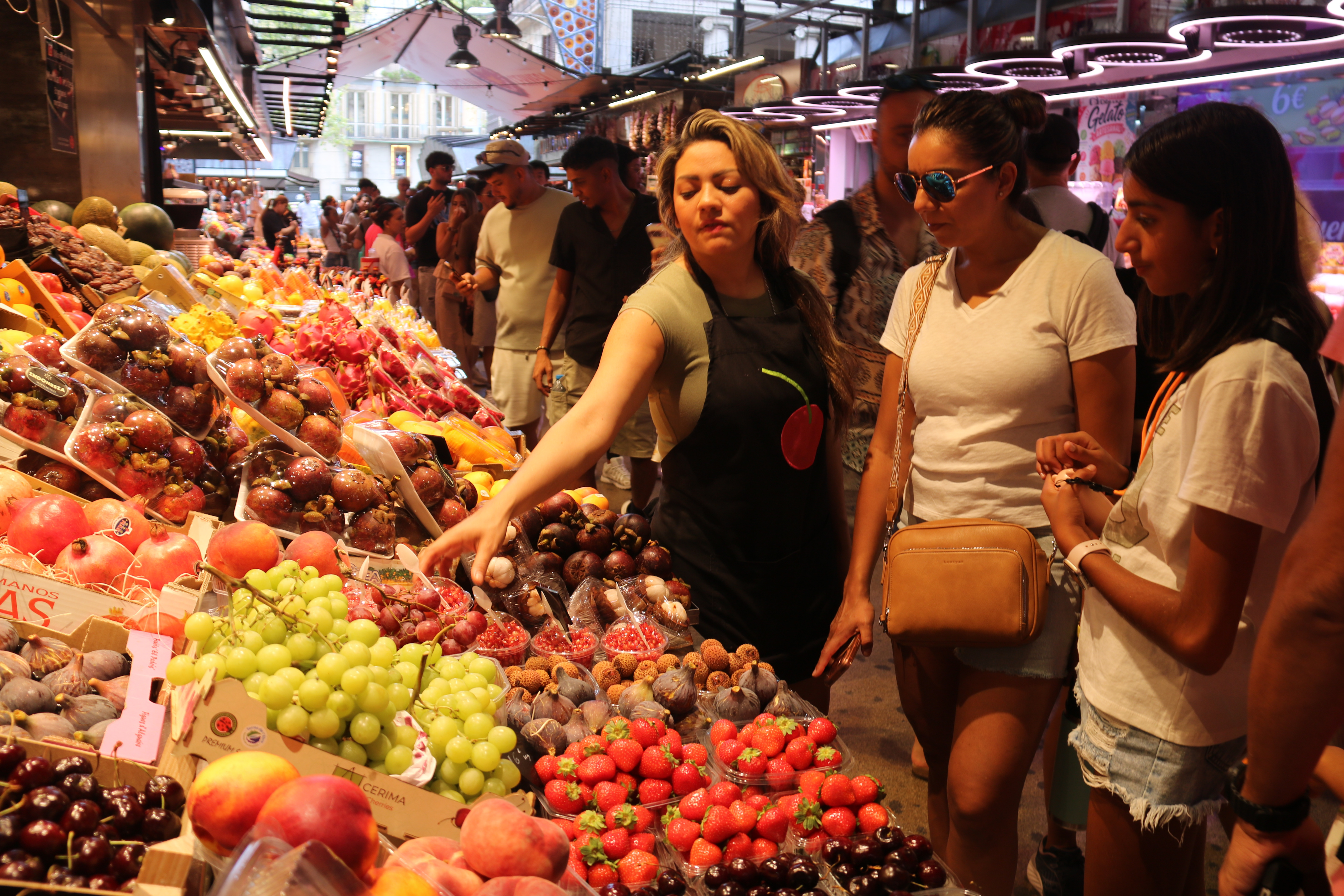 A fruit seller at La Boqueria market
