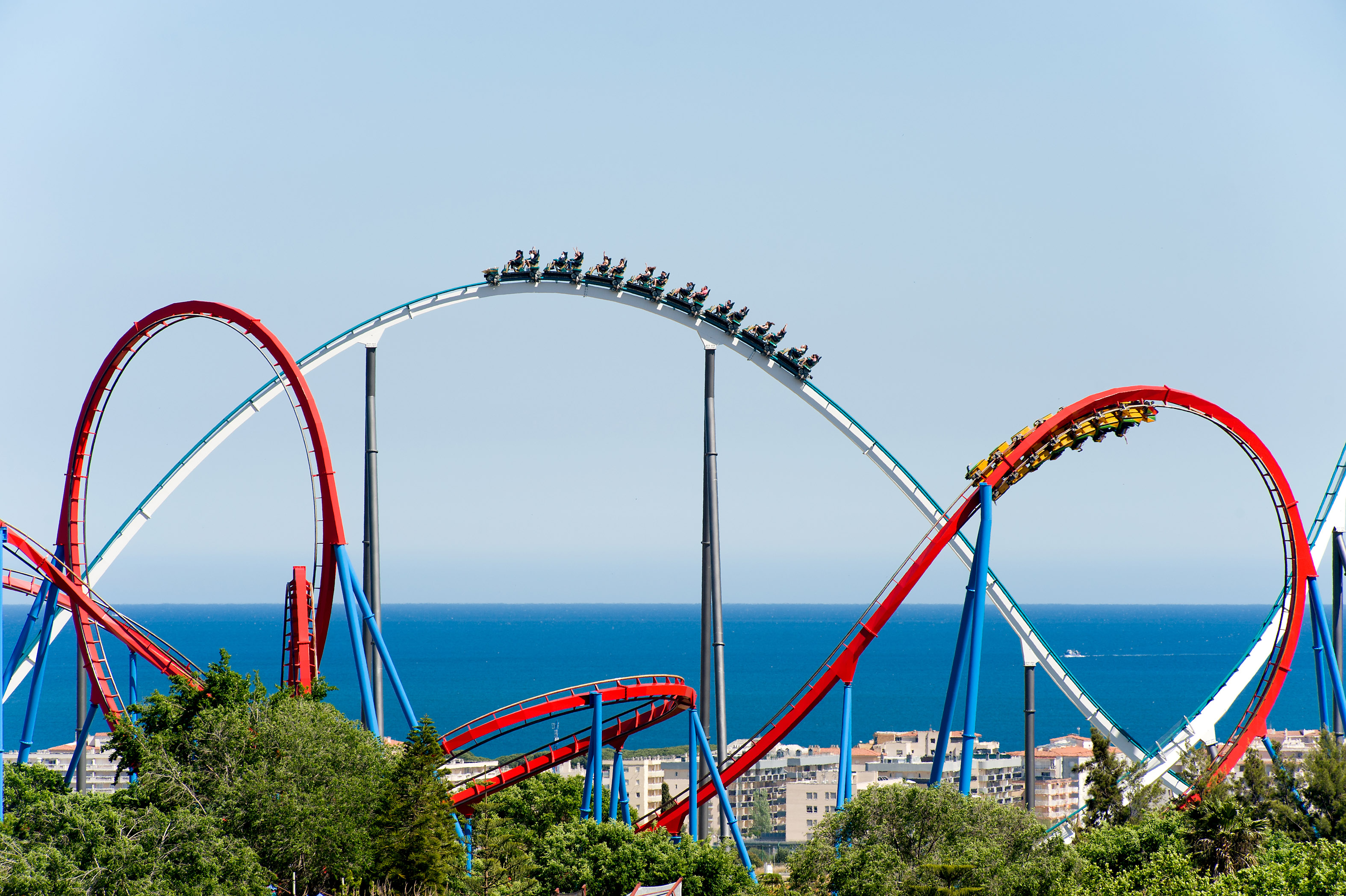 A photo of PortAventura's roller coasters: Dragon Khan (in red) and Shambhala (in white)