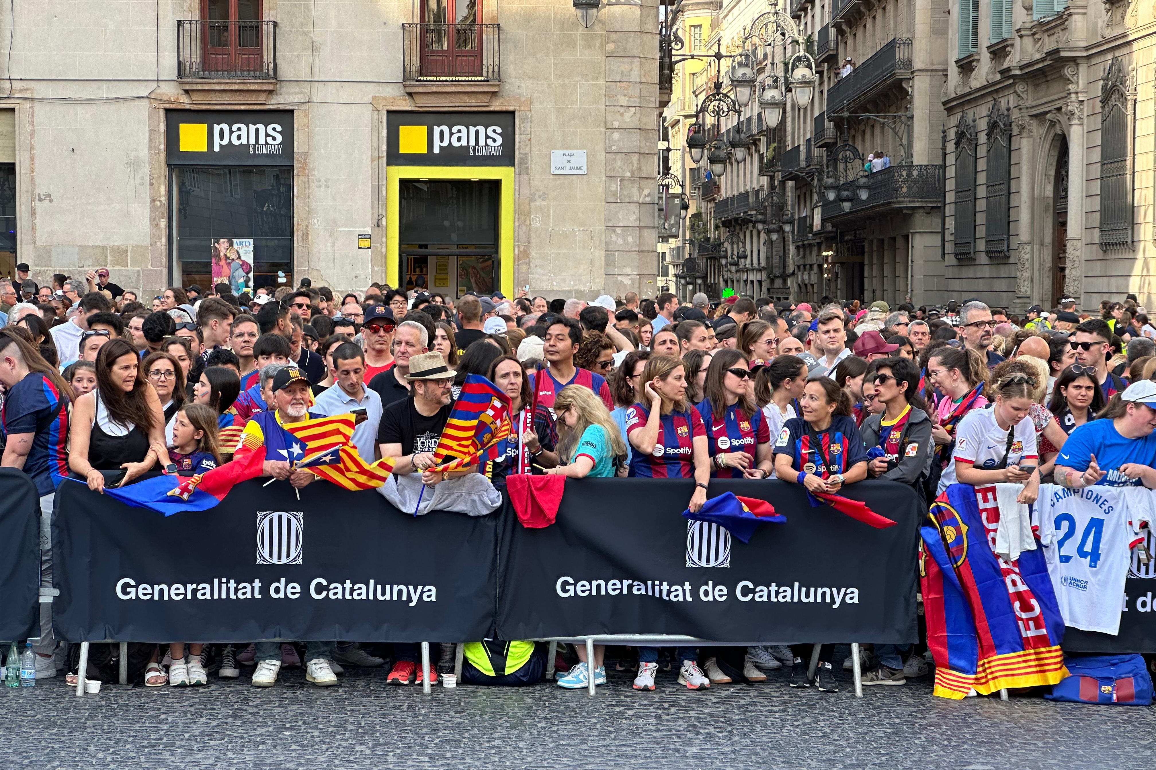 Barça Femení fans gather at the Plaça Sant Jaume square ahead of the official celebration of the UEFA Women's Champions League trophy on May 26, 2024