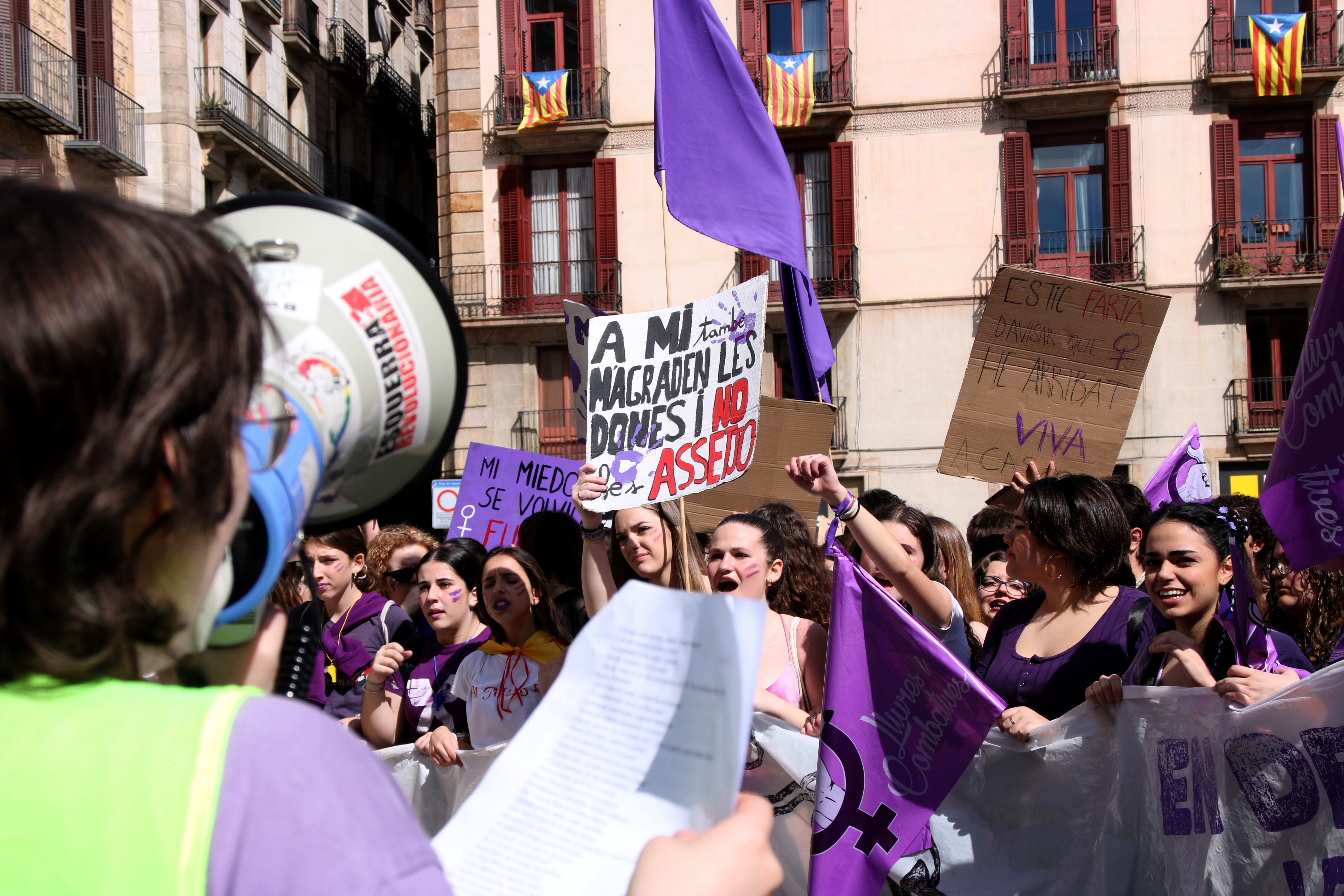 Students protesting for International Women's Day in front of the Barcelona city council and Catalan government headquarters buildings