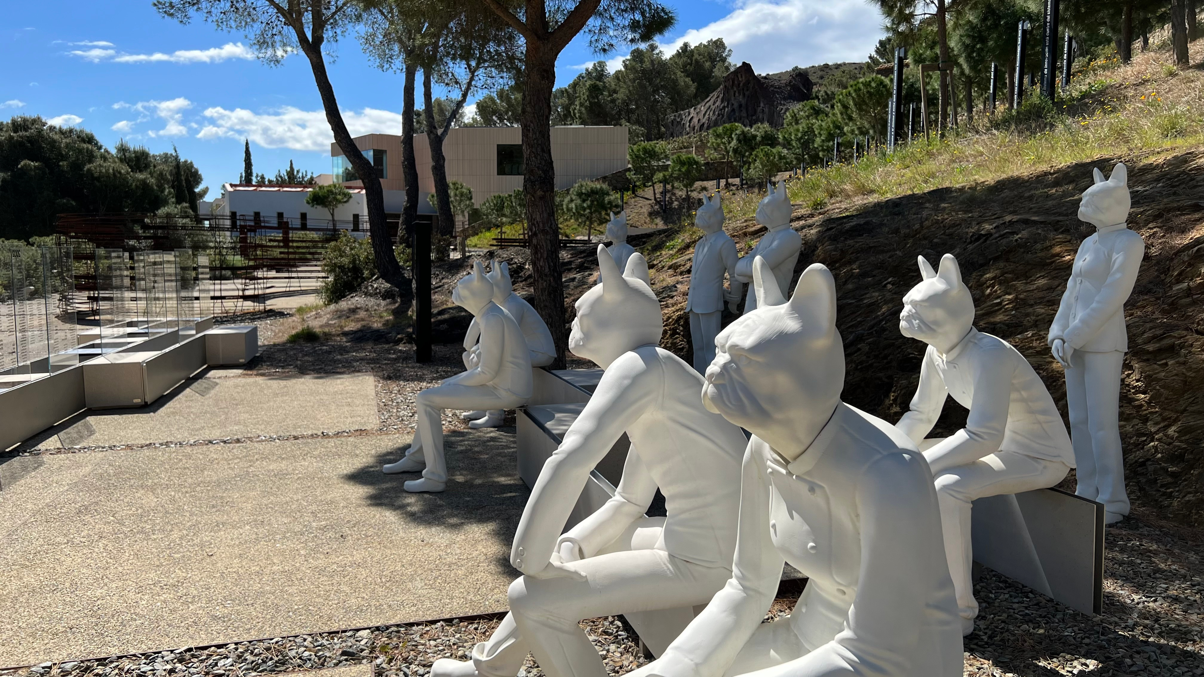 Statues with a French bulldog as head in the outside area of elBulli1846