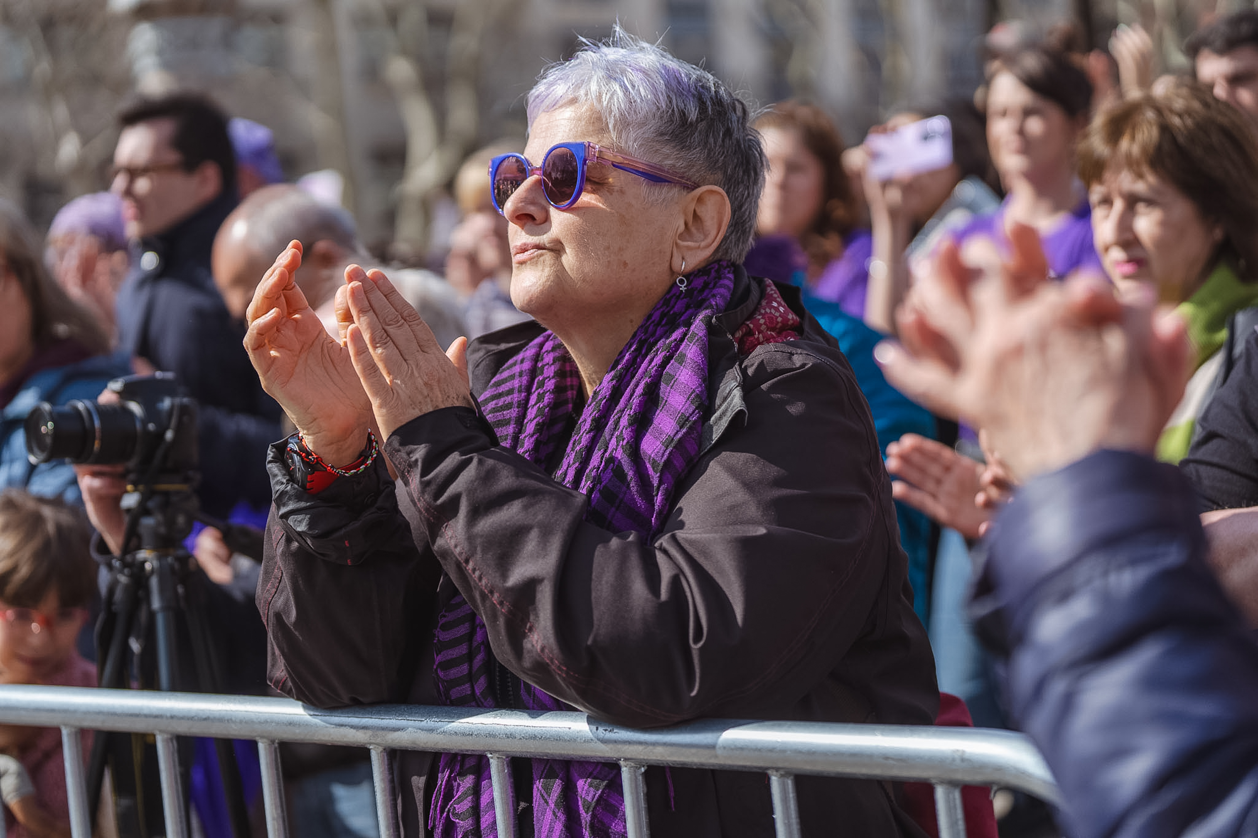 A woman applauds at the International Women's Day march in Barcelona organized by Assemblea 8-M