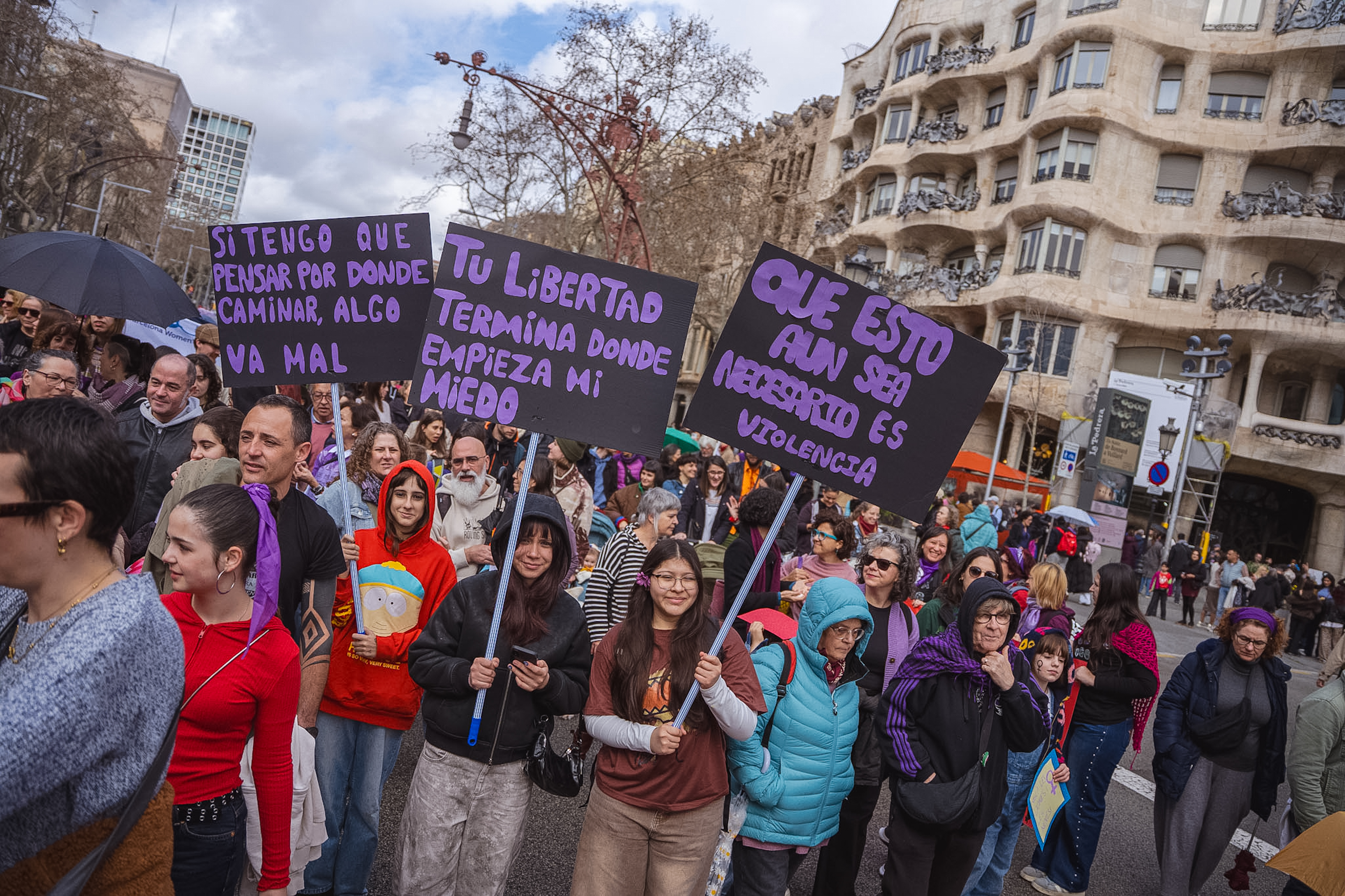 Protesters hold up placards at the International Women's Day march in Barcelona organized by Assemblea 8-M