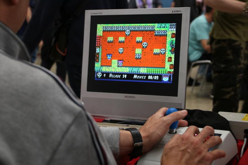A man plays video game at the RetroBarcelona fair, at La Farga de l'Hospitalet complex.