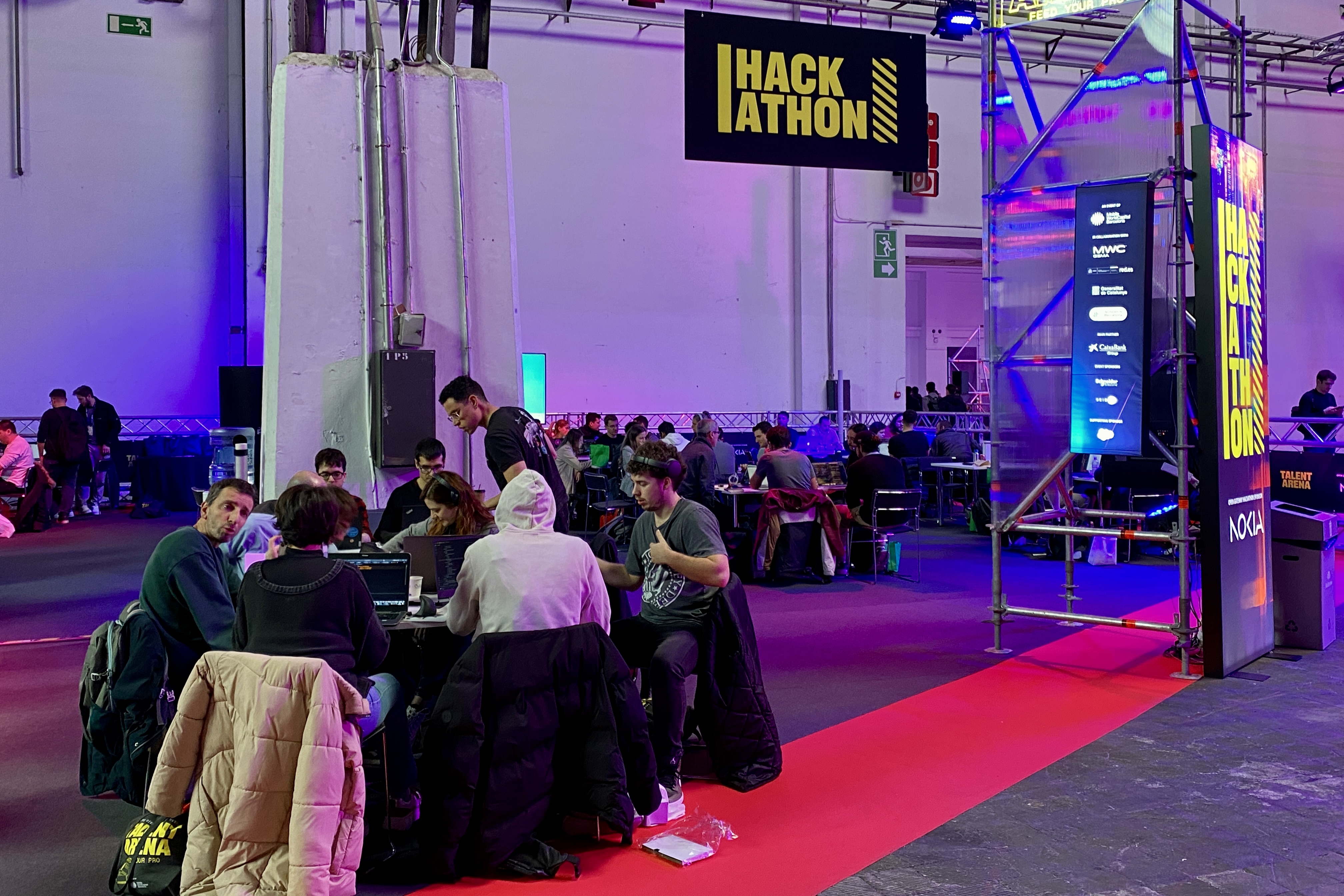 Attendees of the 2025 edition of the Talent Arena developers' fair in Barcelona during a hackathon event