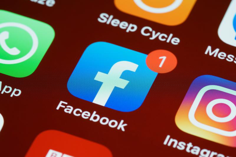 The Facebook app on a mobile device next to the WhatsApp and Instagram apps