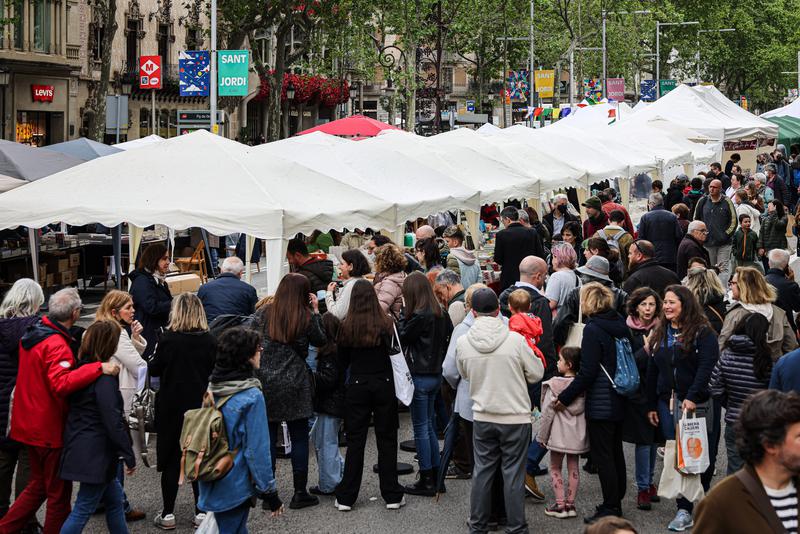 People browse book stalls in Barcelona's literary superblock on April 23, 2022, Sant Jordi's Day