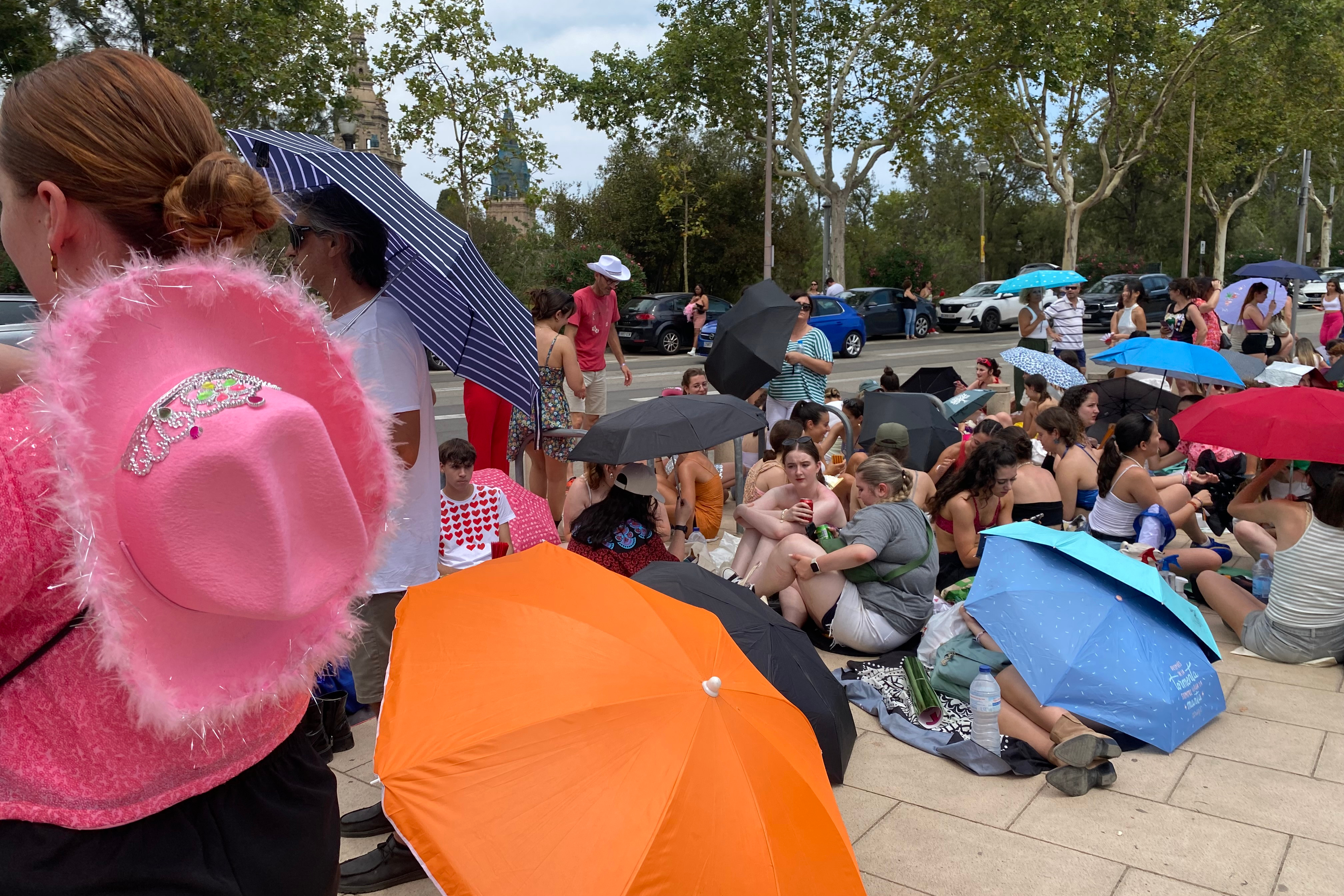 Harry Styles fans await under the heavy sun before his concert in Barcelona on July 12, 2023