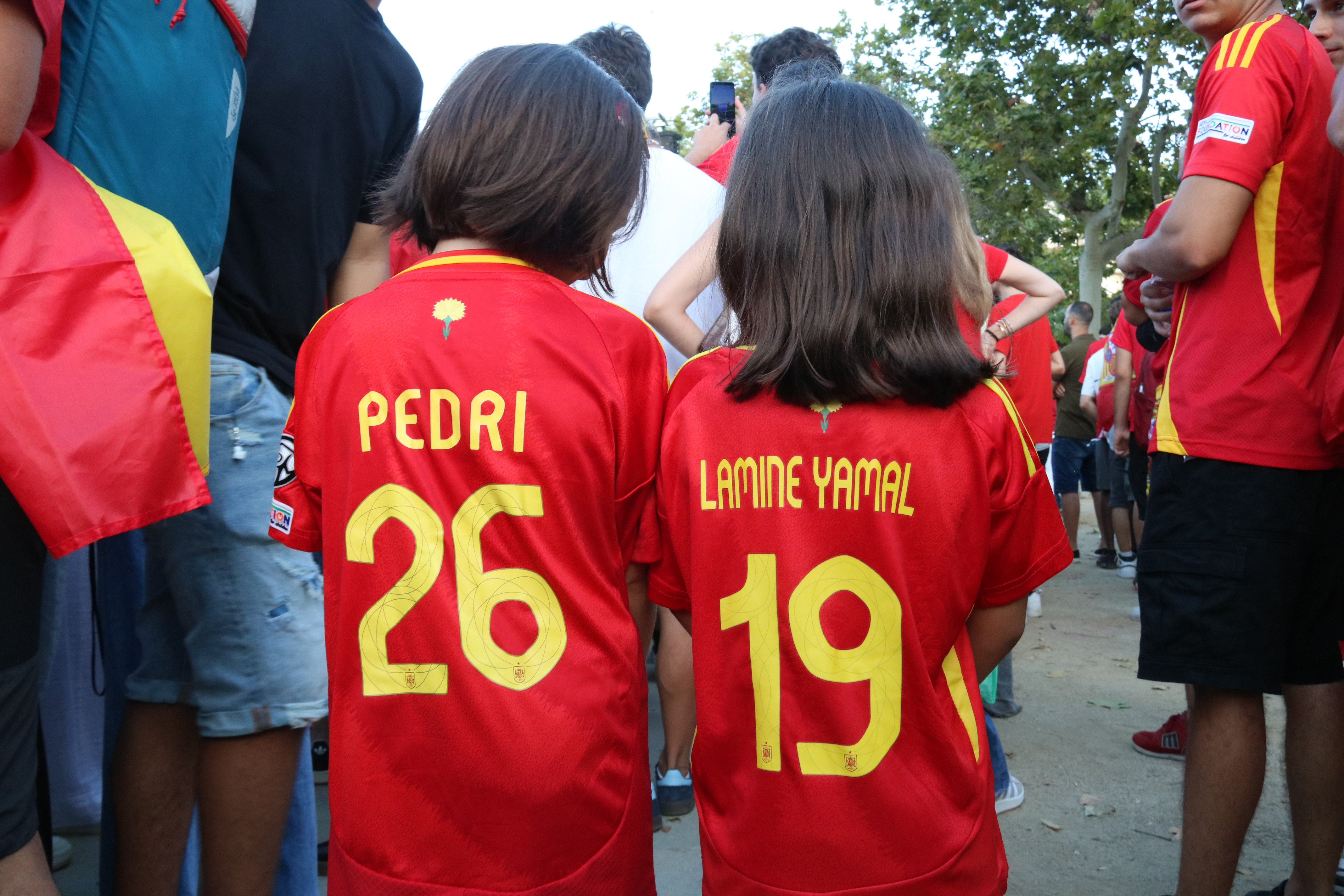 Two girls in Mataró wearing Pedri and Lamine Yamal Spain's jerseys during the Euro 2024 final facing Spain against England on July 14, 2024