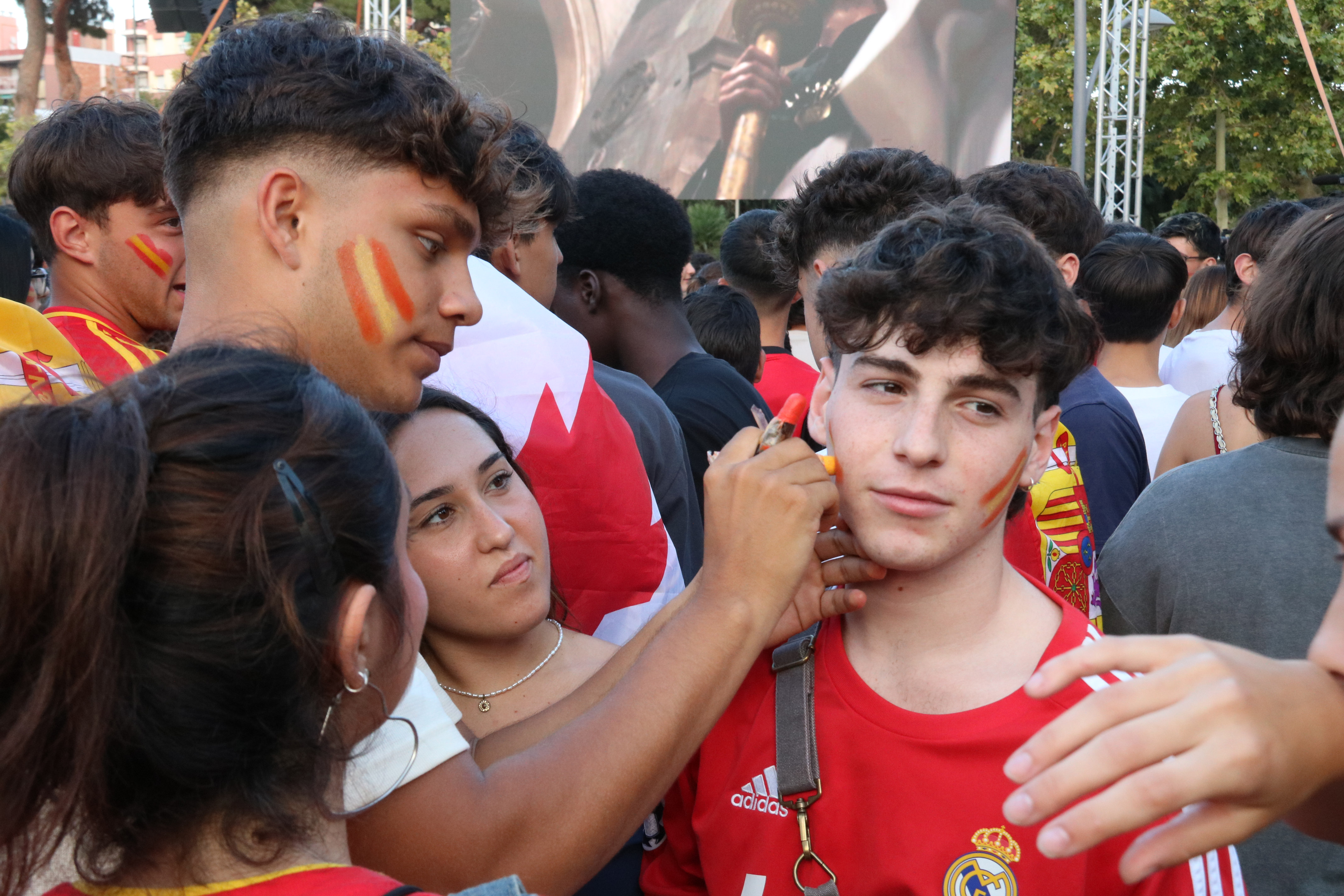 Spain football team supporters painting Spanish flags on their faces during the Euro 2024 final game facing Spain against England in Mataró, Yamine Lamal's hometown, on July 14, 2024