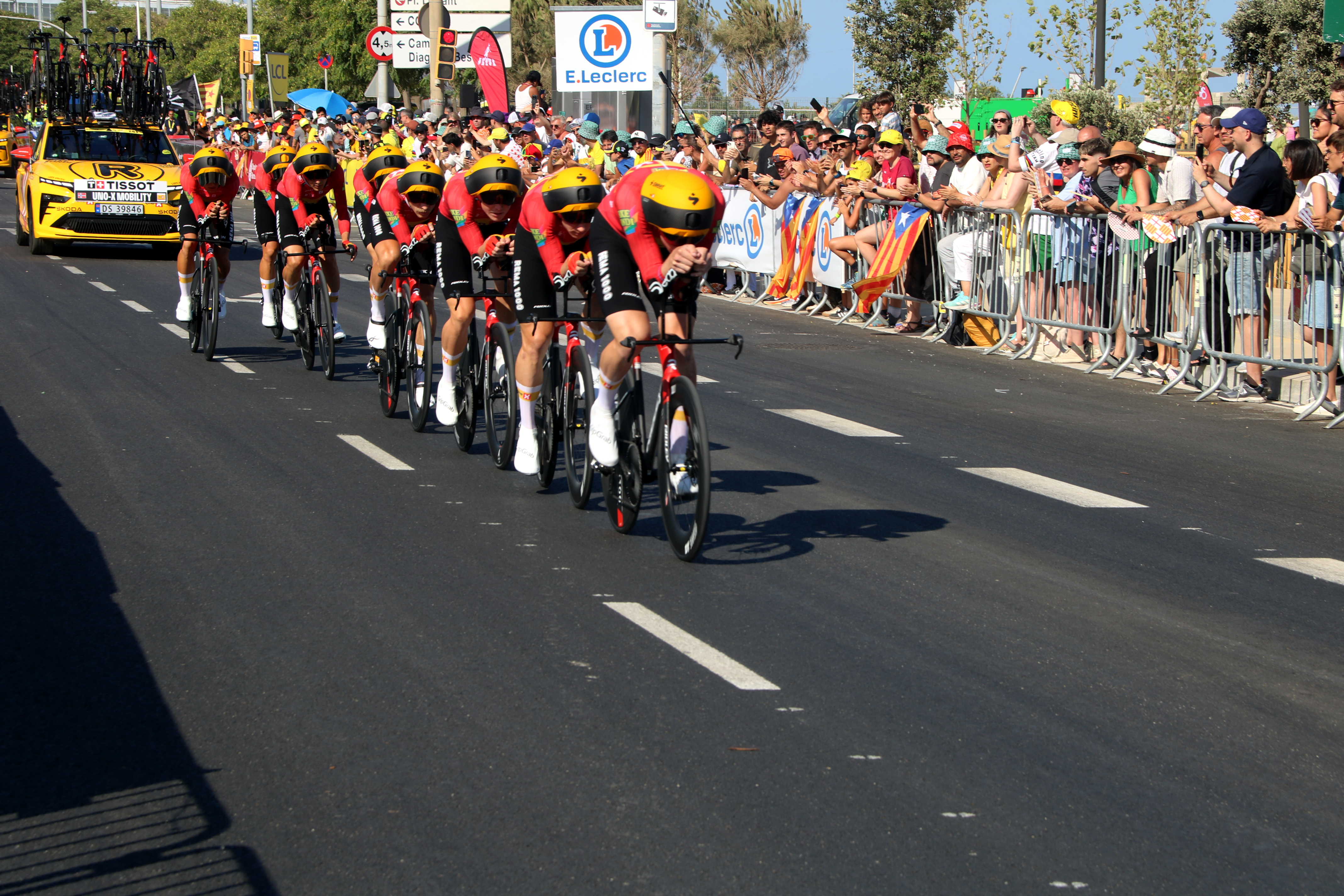 The Uno-X-Mobility team begins its time trial through Barcelona for the Tour