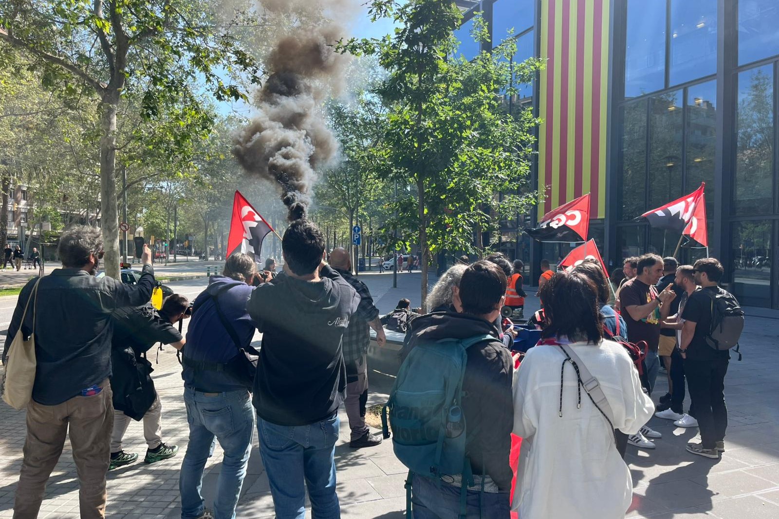 A handful of CNT labor union affiliates demonstrate in front of Mediapro offices