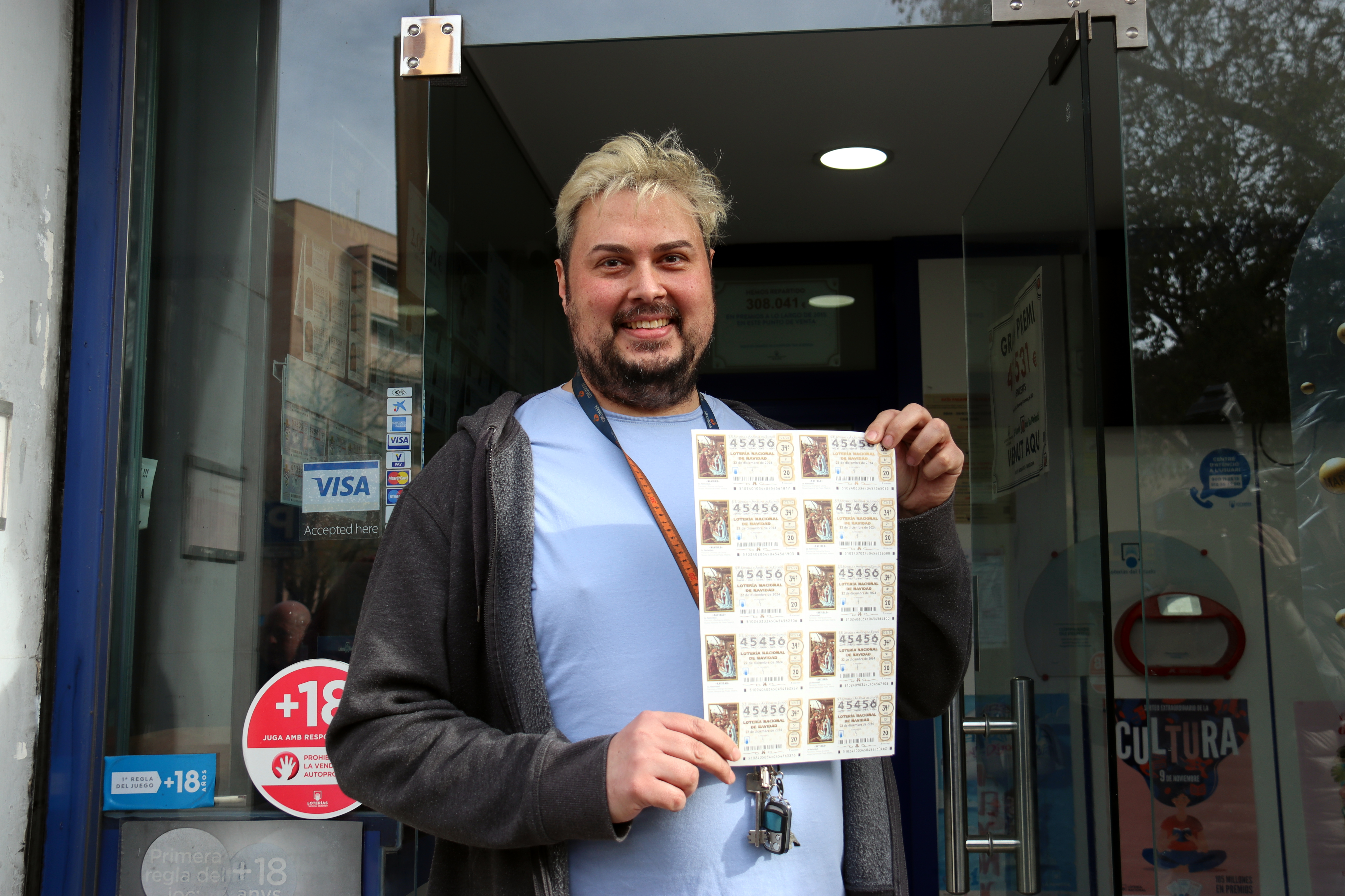 Frances Cuenca, of the Barcelona 11 administration, shows several awarded tickets for the 2024 Christmas lottery