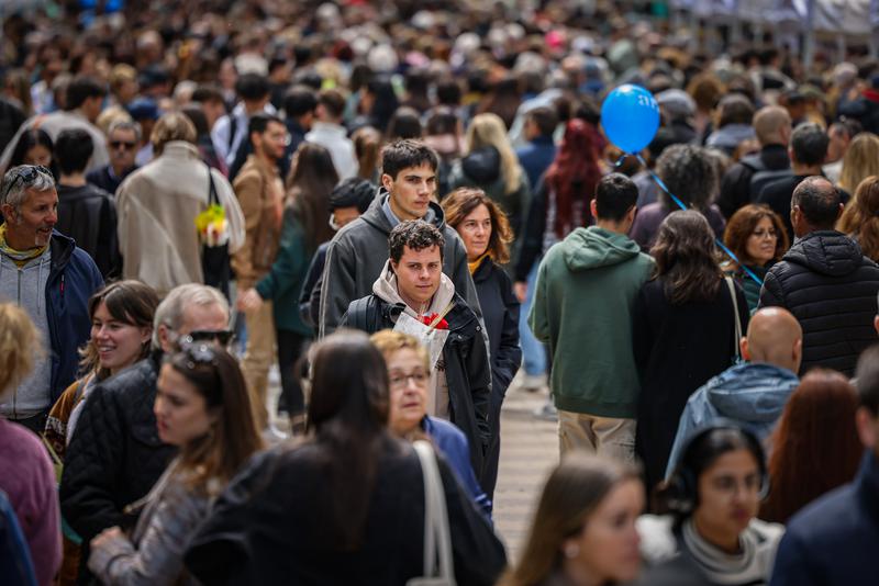 People walking the streets of Barcelona on Sant Jordi's Day 2024