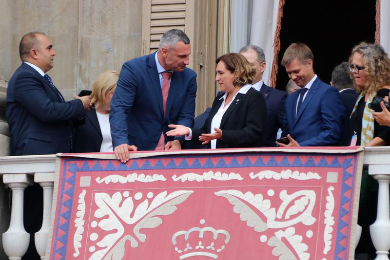 Barcelona mayor Ada Colau and Kyiv mayor Vitali Klitschko watching human towers from the balcony of the Barcelona council headquarters on September 23, 2022