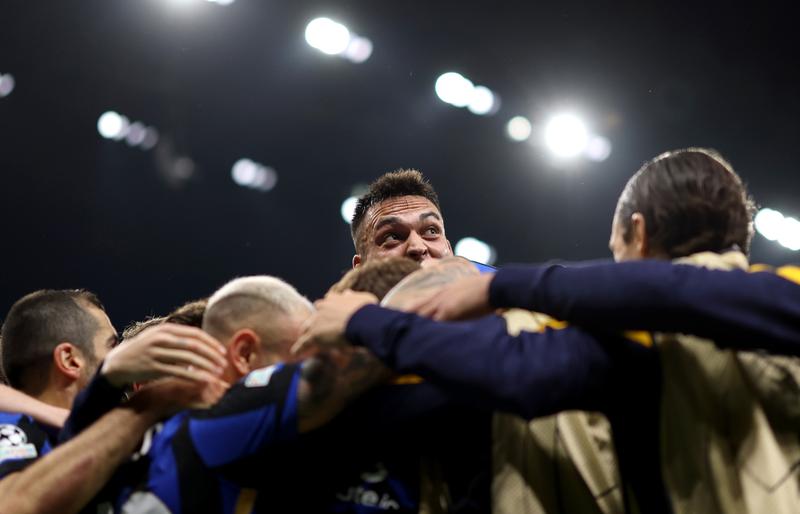 The players of FC Internazionale celebrate after Hakan Calhanoglu scores his team's second goal from the penalty-spot