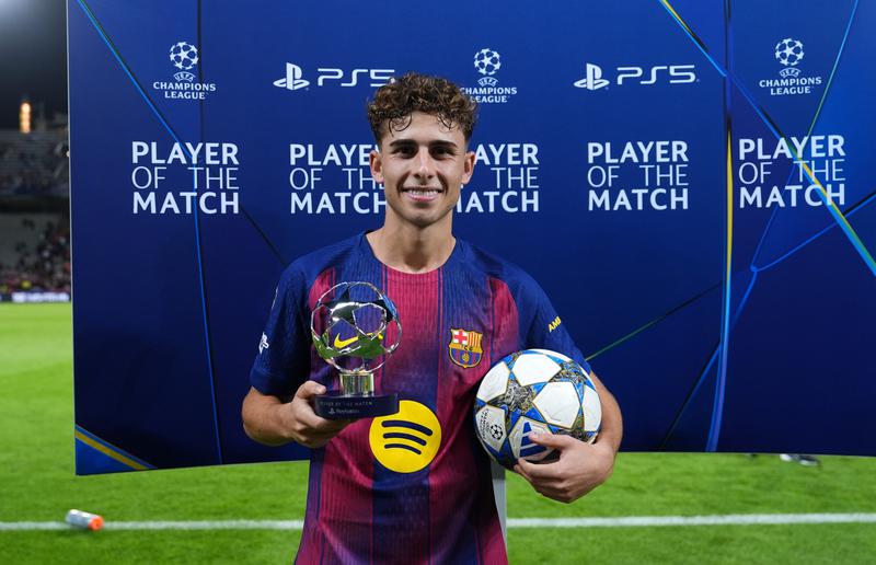 Fermin Lopez of FC Barcelona poses for a photo with the PlayStation Player Of The Match award and match ball after scoring a hat-trick during the UEFA Champions League 2025/26 match between FC Barcelona and Olympiacos FC on October 21, 2025