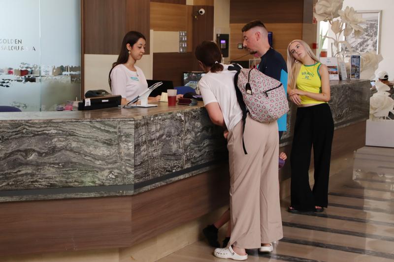 Tourists checking into a hotel in Salou