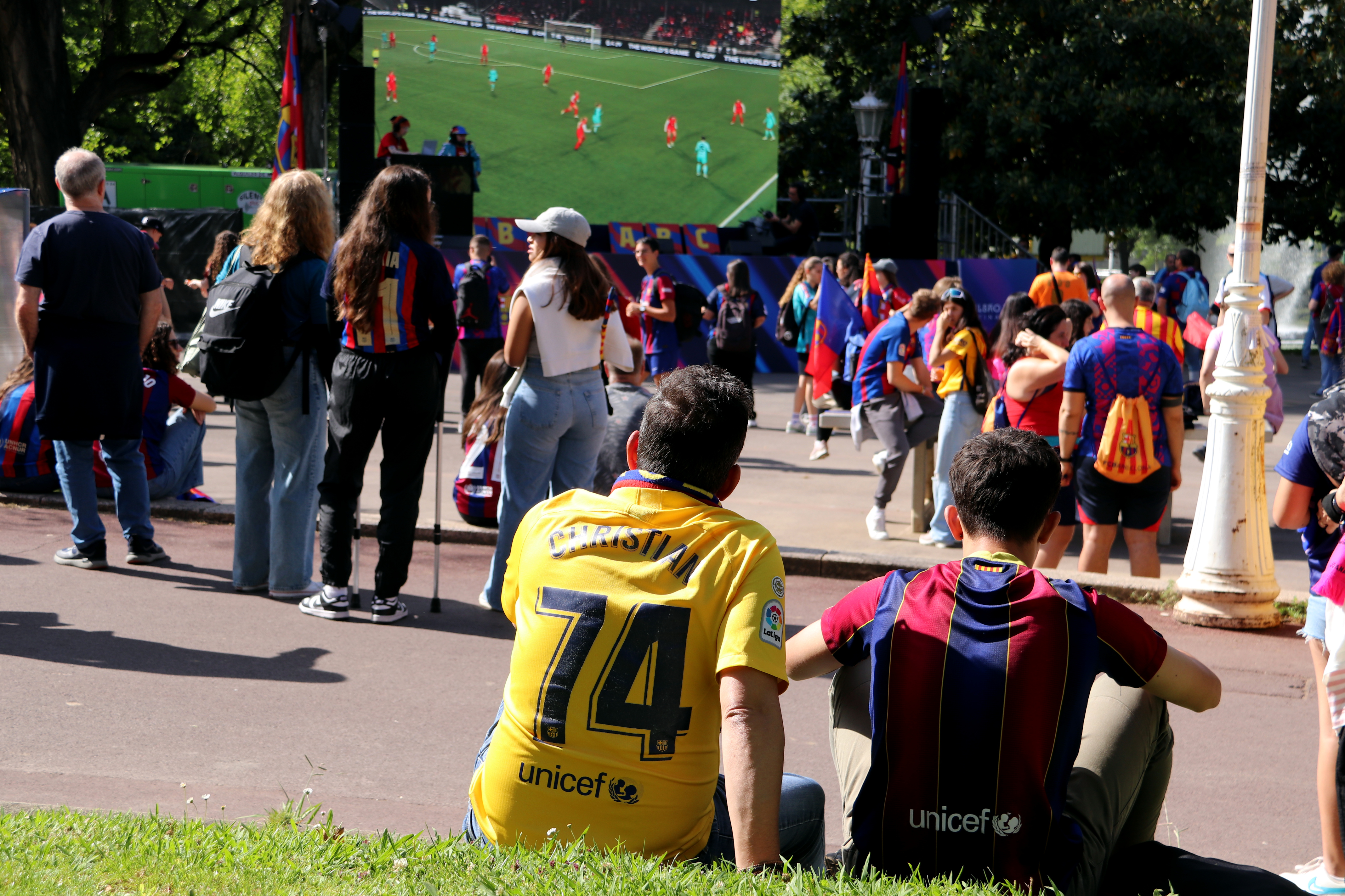 Some Barça Femení fans watching some past matches at the Barça's Fan Meeting Point in Bilbao ahead of the UEFA Women's Champions League Final on May 25, 2024