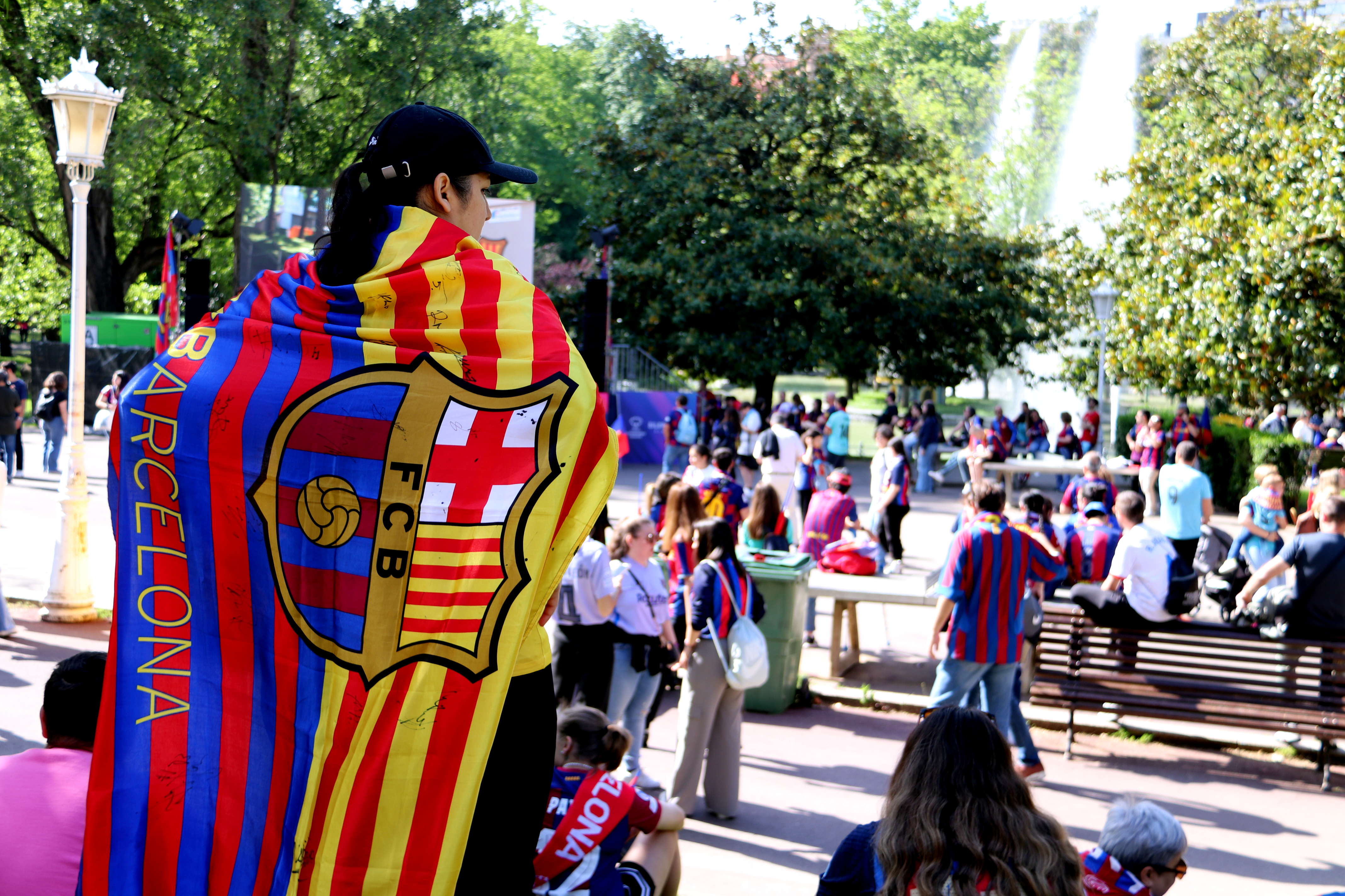 A Barça supporter wearing a FC Barcelona flag in Bilbao ahead of the UEFA Women's Champions League on May 25, 2024