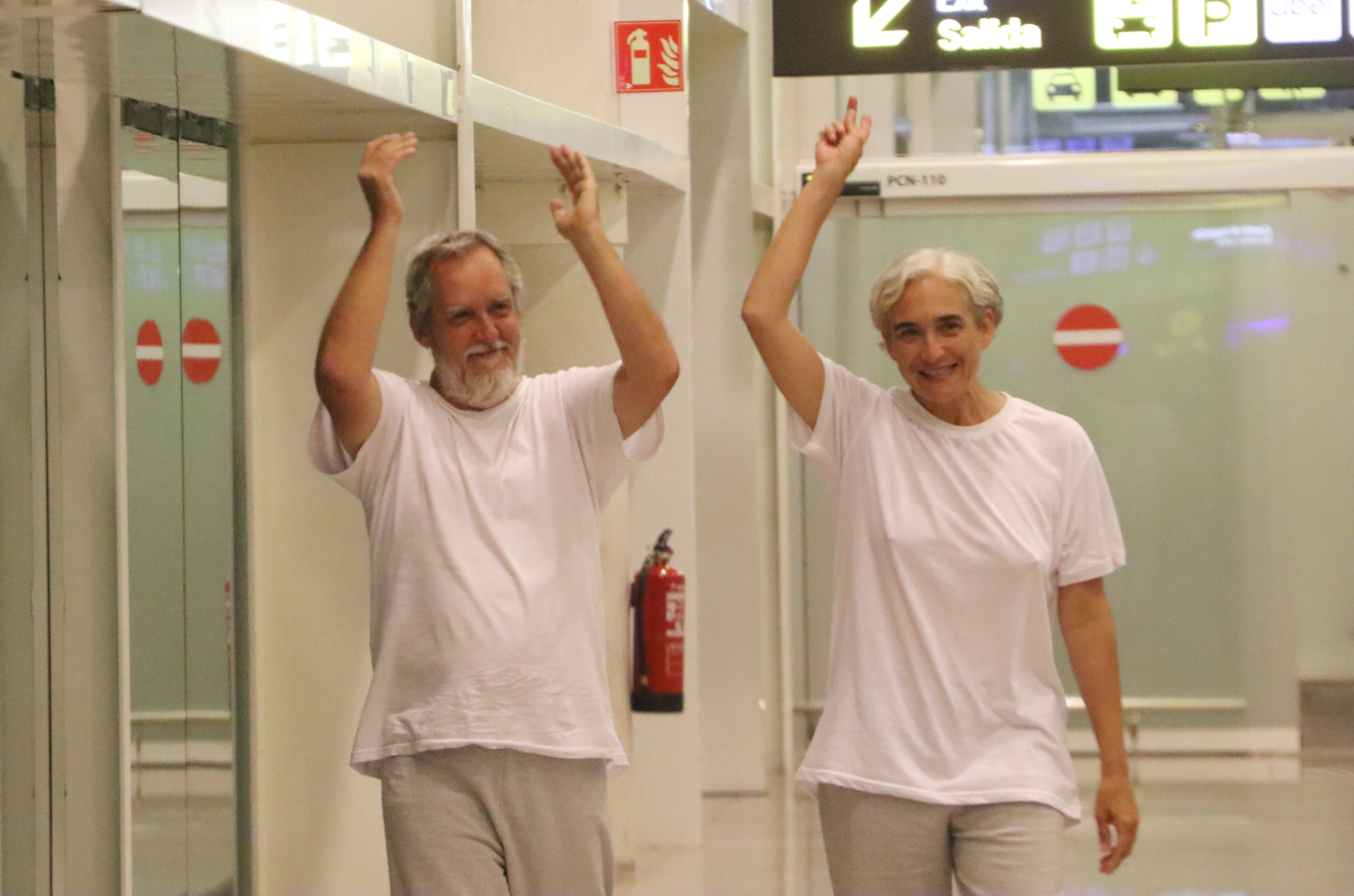 Esquerra city councillor in Barcelona, Jordi Coronas, and former mayor Ada Colau arrive at Barcelona airport