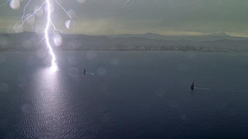 Lighting hitting the ocean close to the boats racing in the America's Cup on Tuesday September 3, 2024.