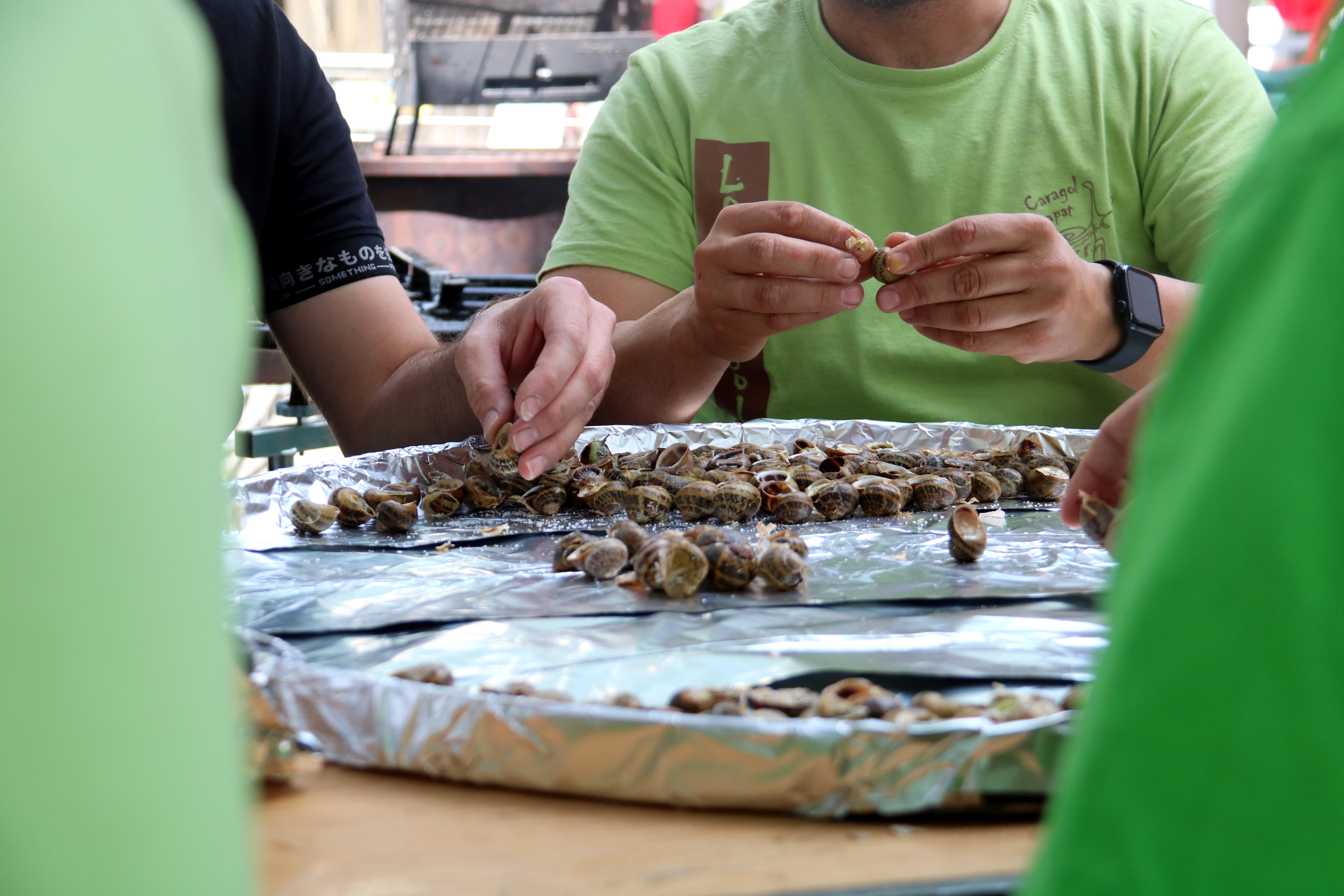 Cooks preparing snails