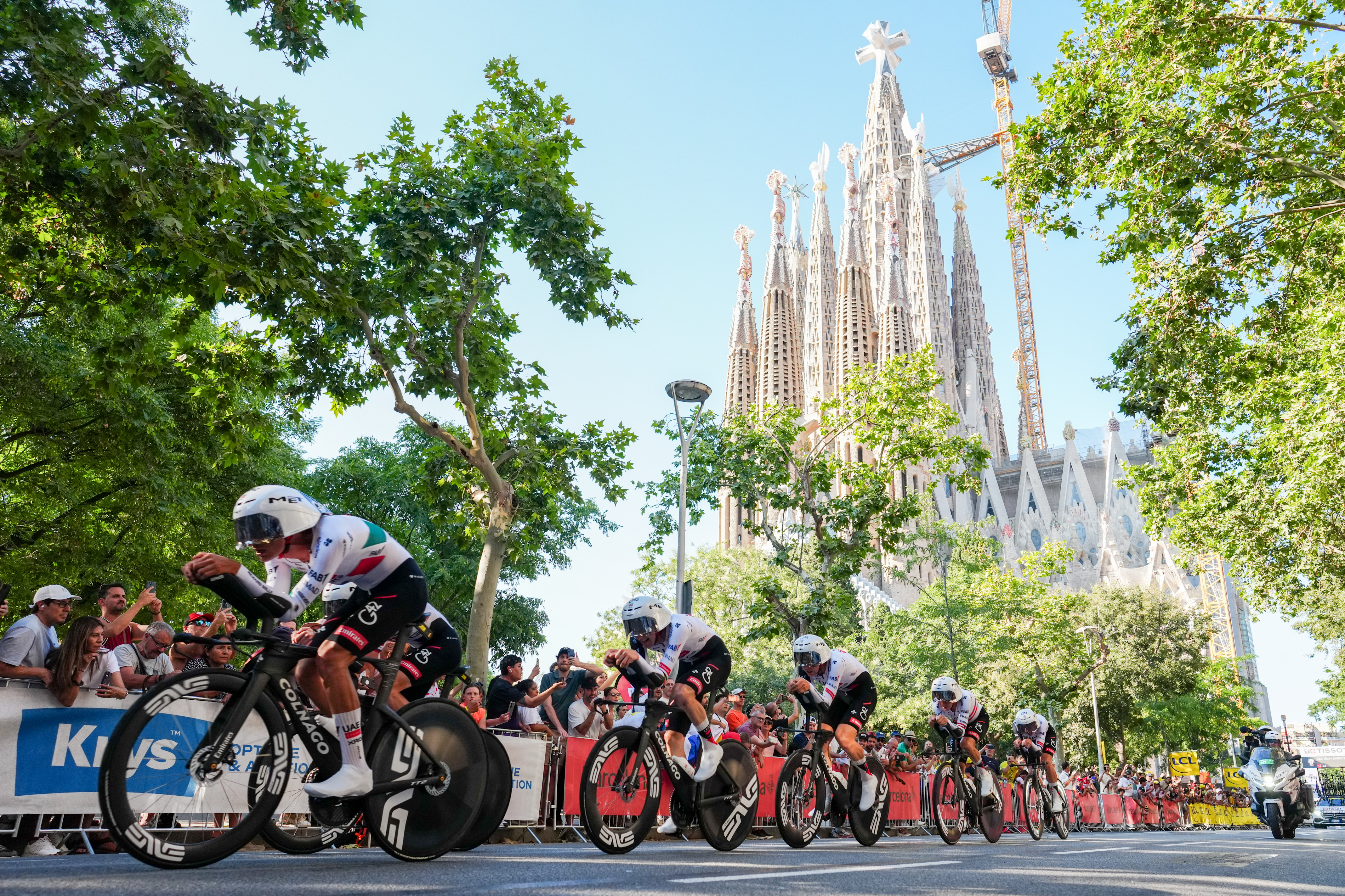 Tadej Pogacar's team, the UAE Team, passing the Sagrada Família in stage one of the Tour