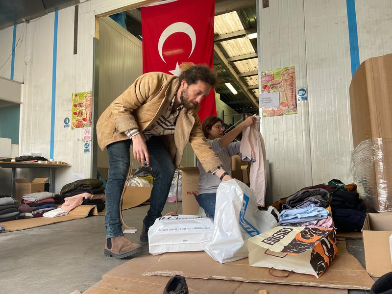 Volunteers sorting clothing donations that will be sent to Turkey on February 10