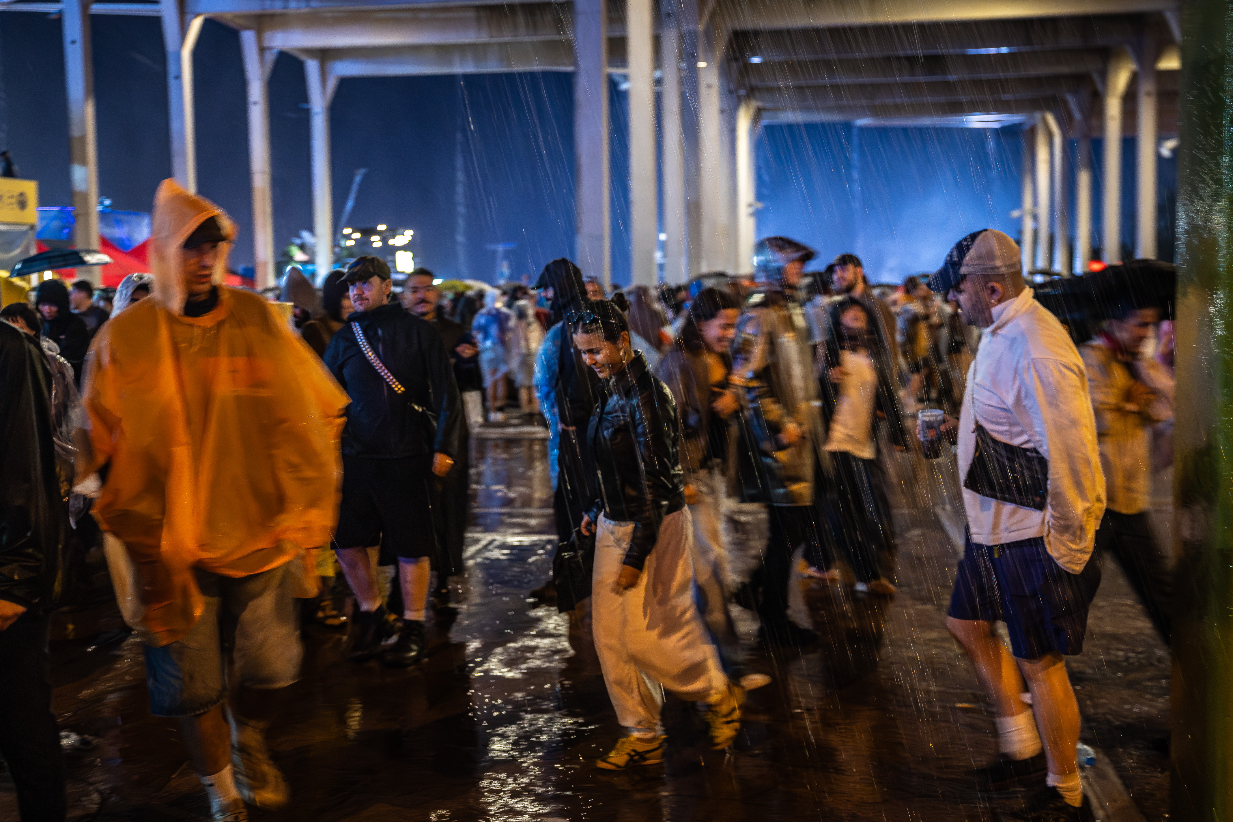 People hide from the rain at Primavera Sound