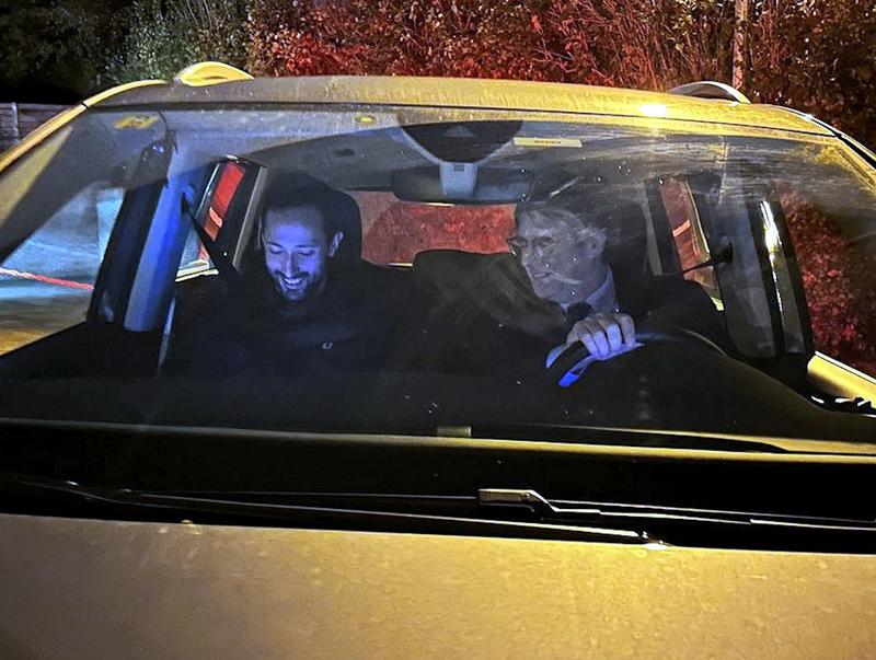 Rapper Valtònyc and former Catalan president Carles Puigdemont sit together in a car