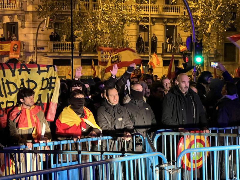 Fascist salutes from some anti-amnesty protesters outside the Socialists' headquarters in Madrid after party reached deal with Junts