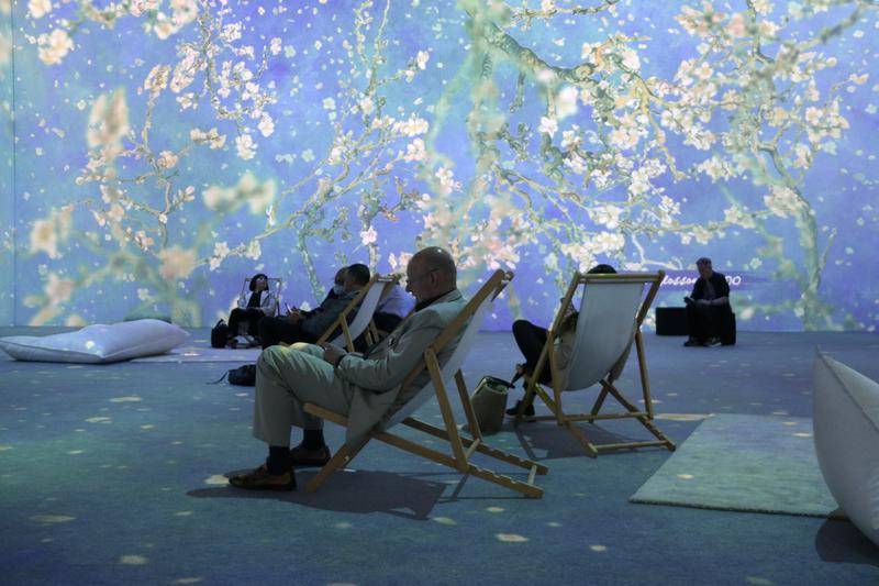 Attendees at 2022 Barcelona's Integrated Systems Europe (ISE) trade show enjoying one of the immersive experiences with art paintings on May 10, 2022