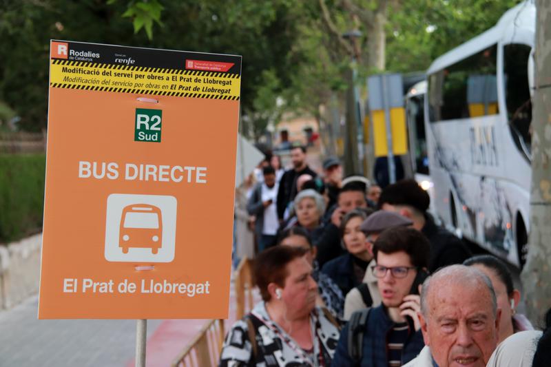 People queue for replacement buses