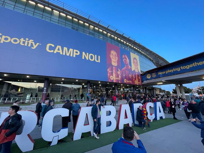 Barça fans gather outside the Camp Nou stadium ahead of kickoff for a game