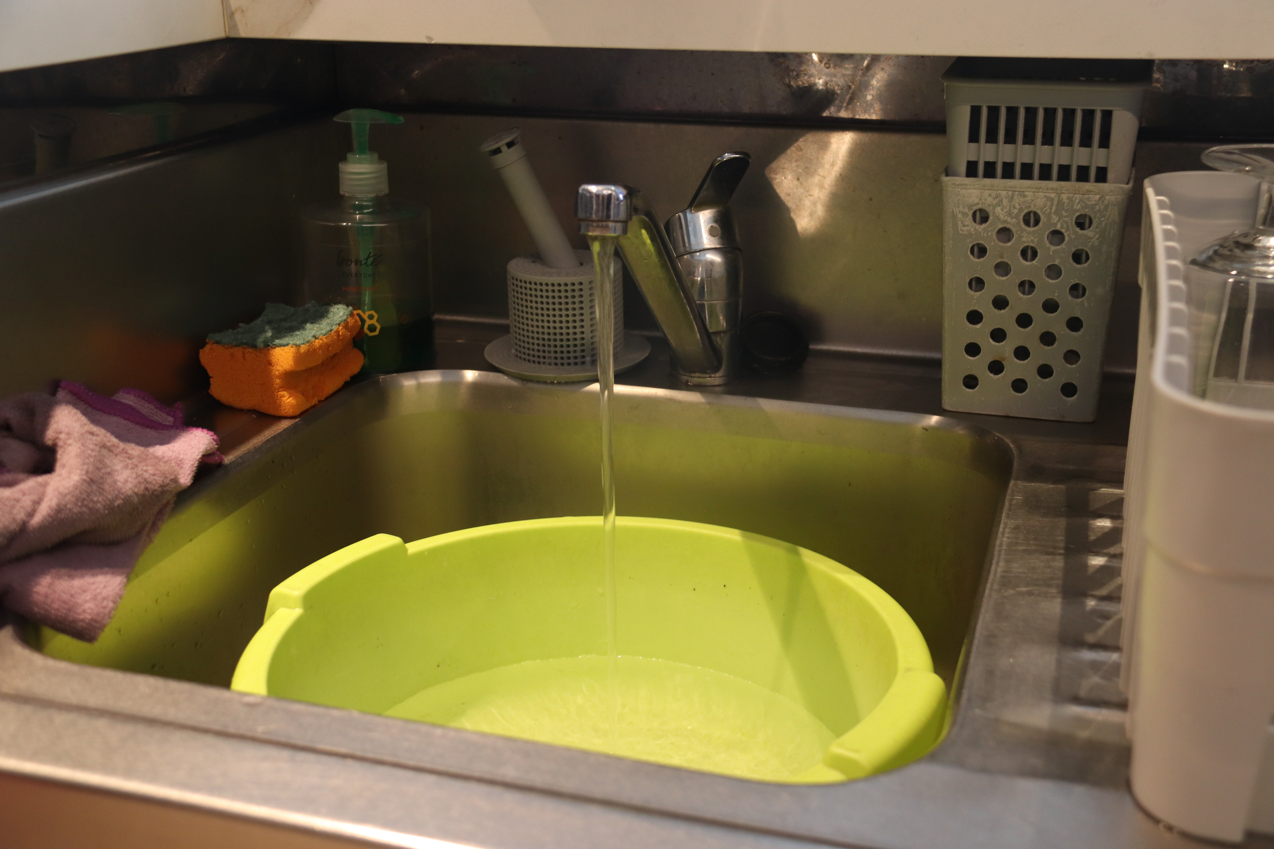 A small stream of water comes out of a tap in a bar in Port de la Selva.