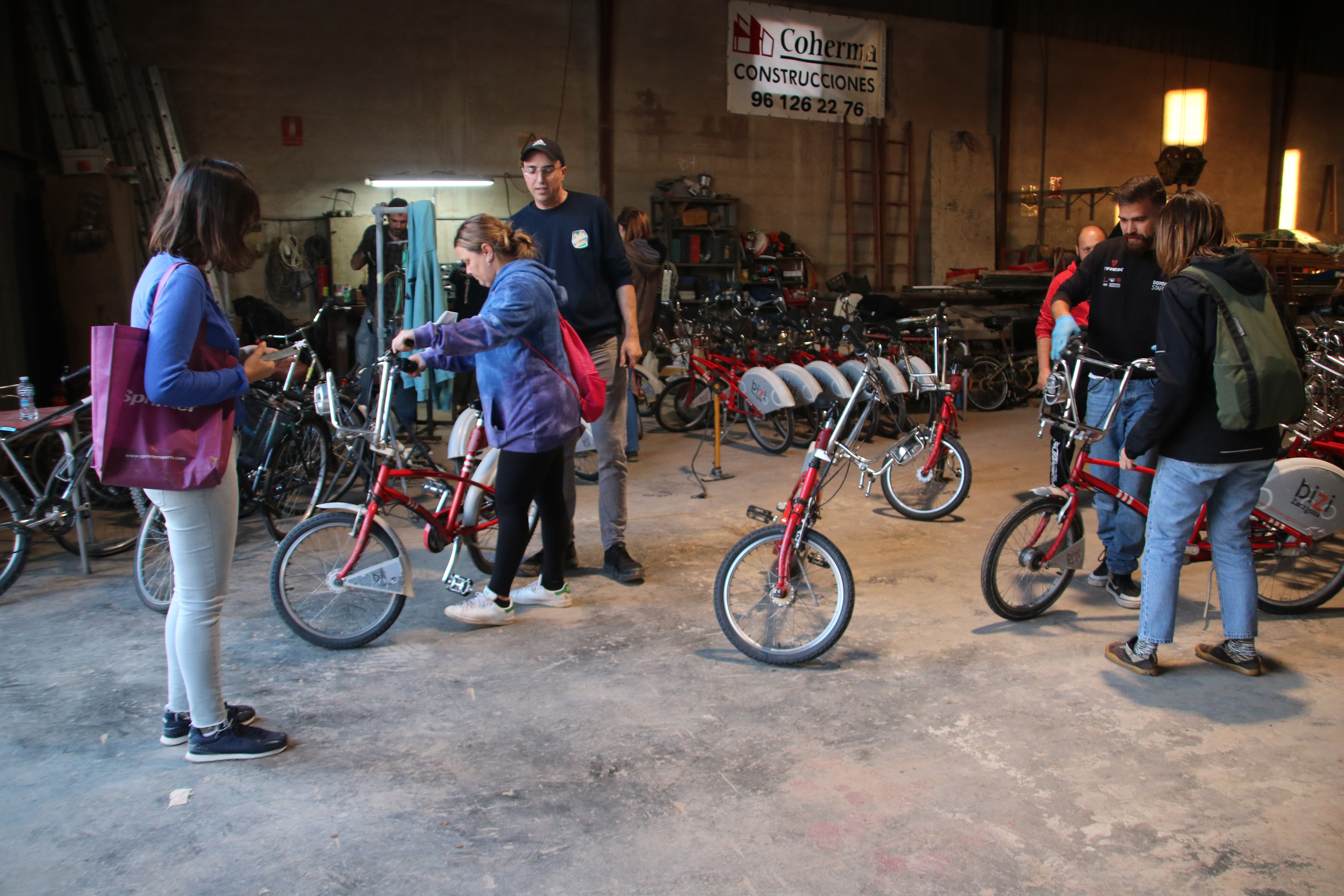 People affected by the Valencia floods collect their solidarity bicycles