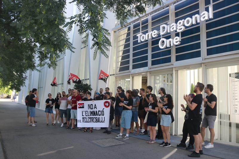 Striking Ubisoft Mobile Barcelona workers gather at the office doors