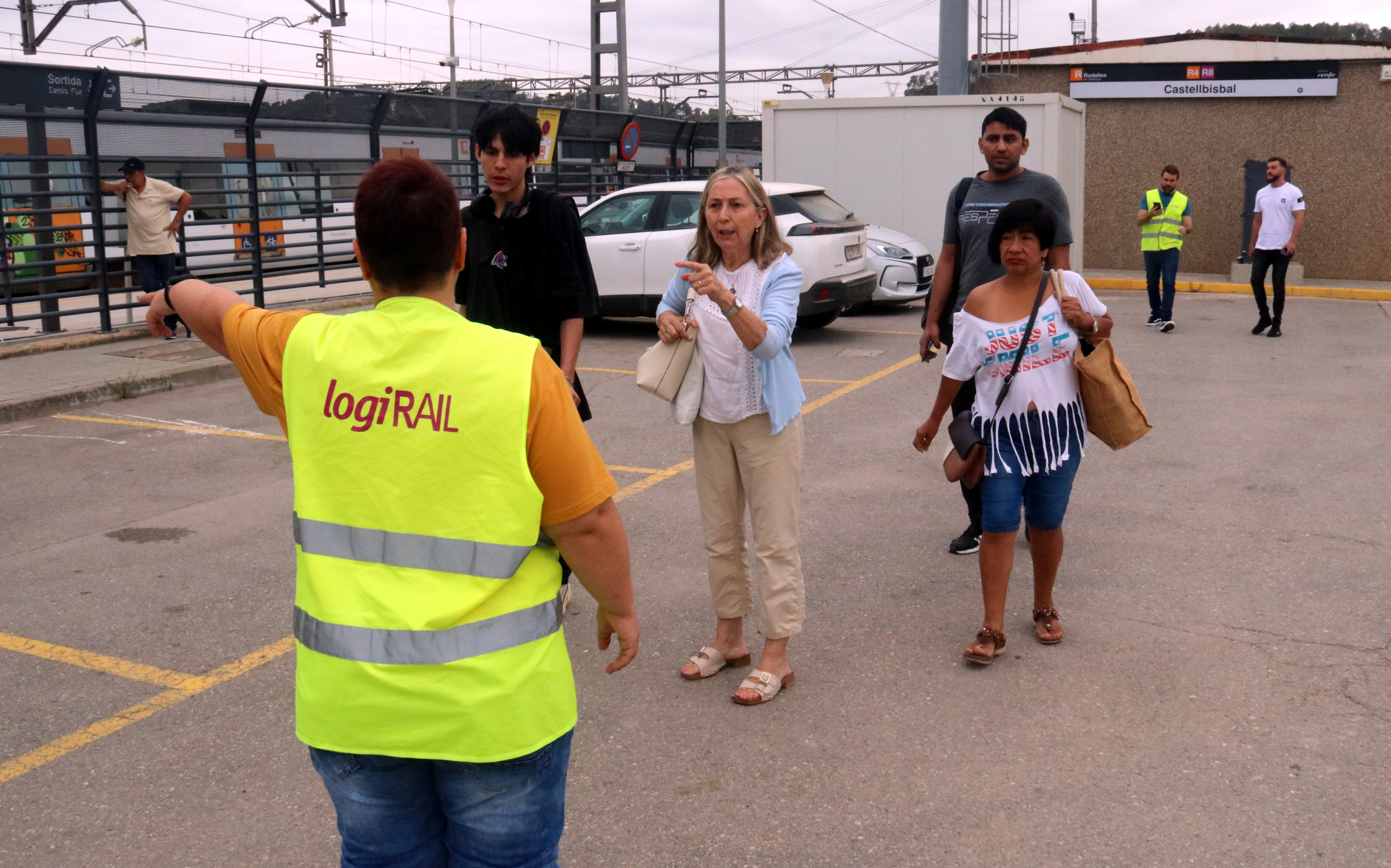 One of the customer service people helping Rodalies commuter train travelers on July 31, 2023 during the partial disruption of the R4 line