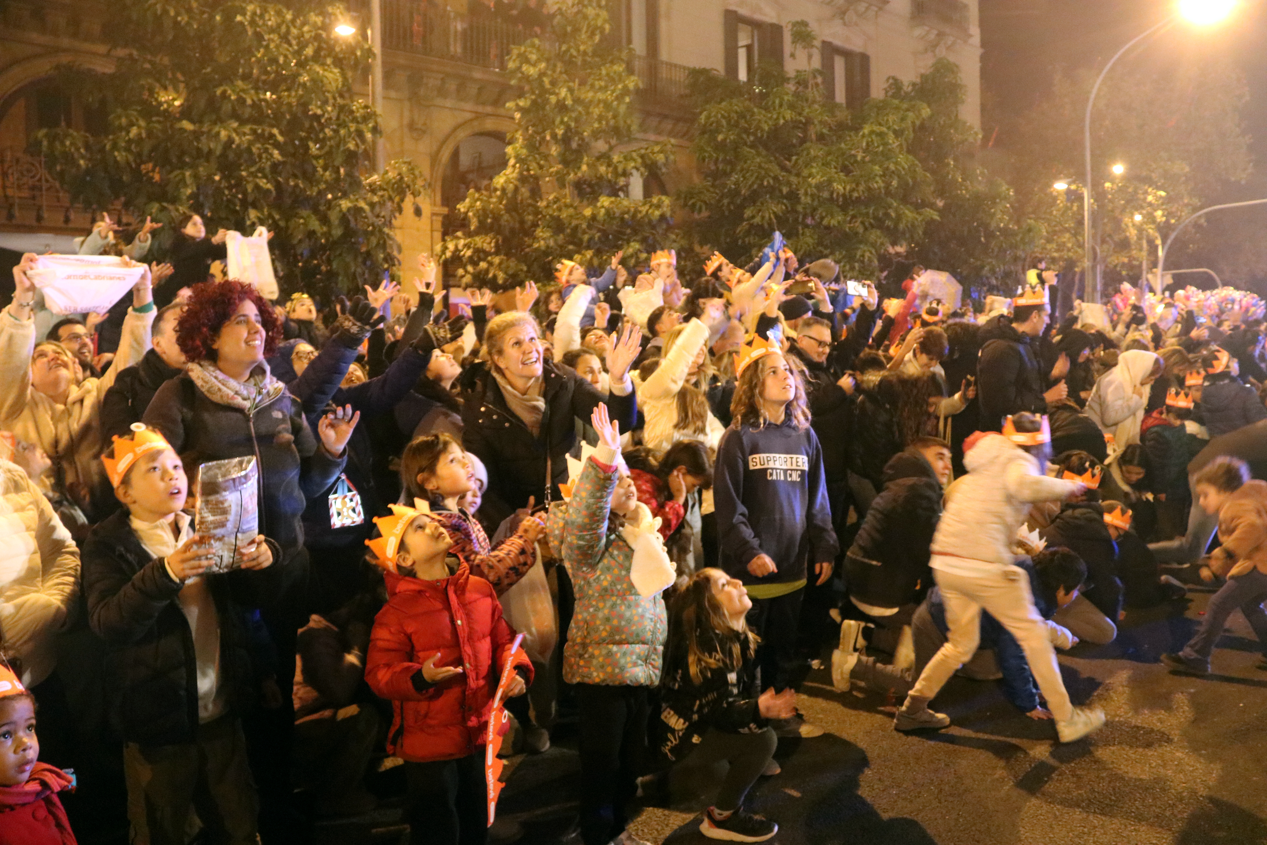 Children from Barcelona collecting candy during the Three Kings parade