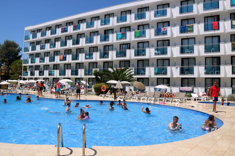 Tourists swimming in a hotel pool on the Costa Daurada, in Vila-seca