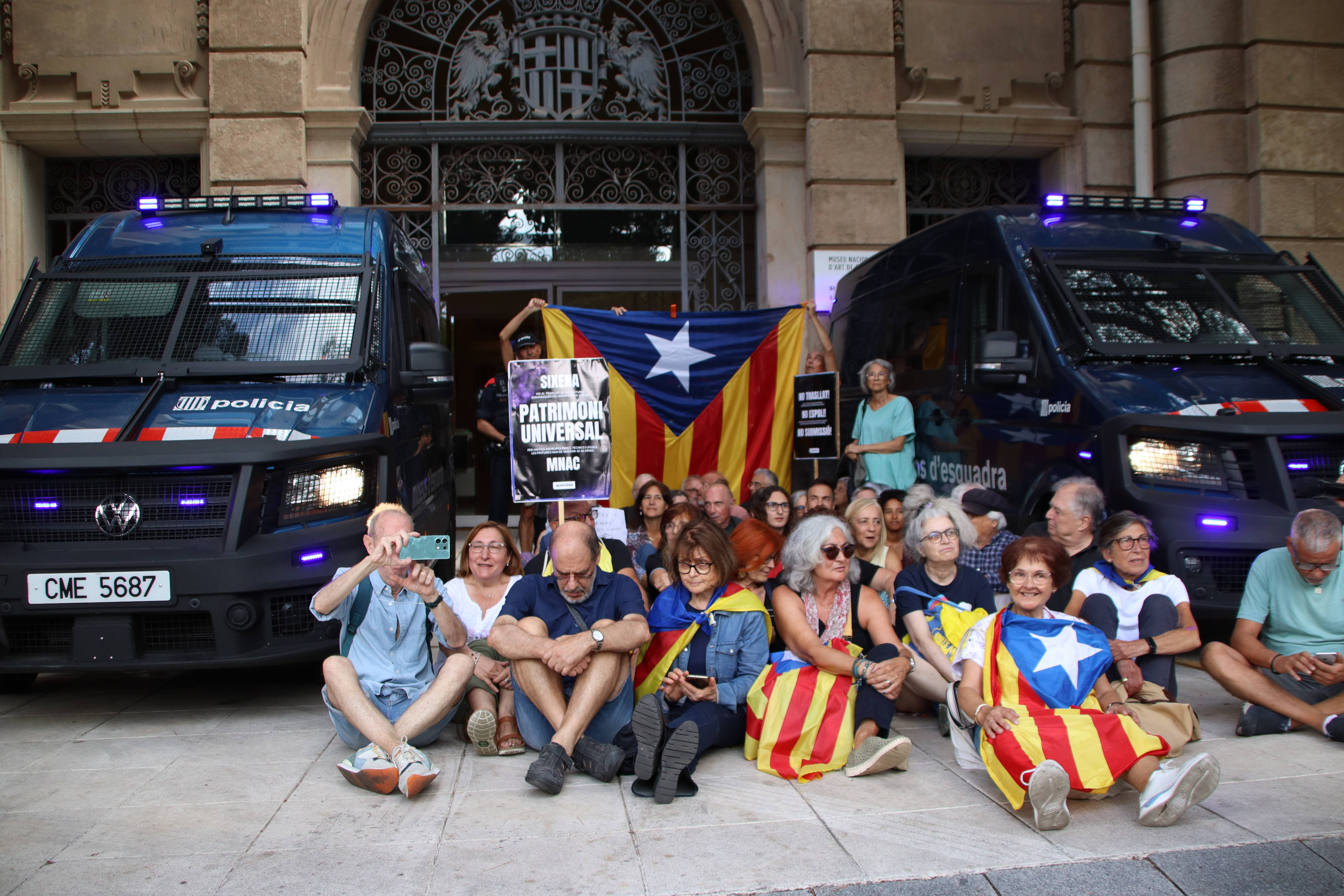 Protesters gathered at one of the entrances to the MNAC