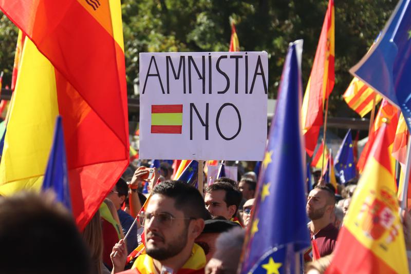 A protest sign against amnesty for Catalan independence leaders in a protest in Madrid, November 18, 2023