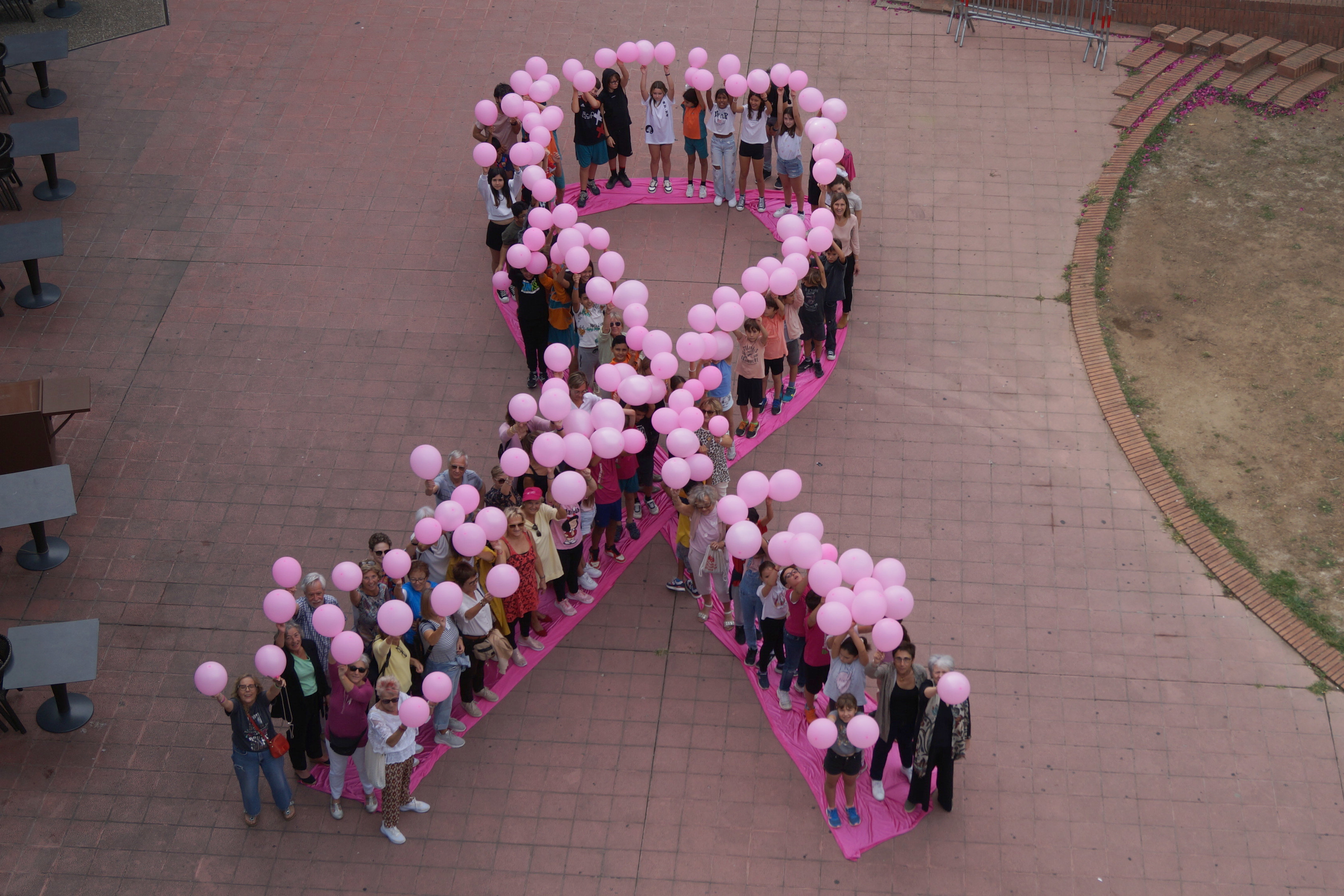 Oncolliga Girona Foundation performs a pink ribbon coinciding with the International Day Against Breast Cancer in 2023