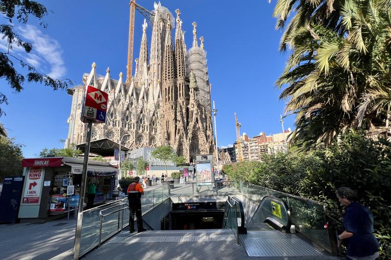 Barcelona's unfinished Sagrada Família Basilica behind the stairs of the metro station where a TikTok trend has forced a ban on leaving the phone on the escalator