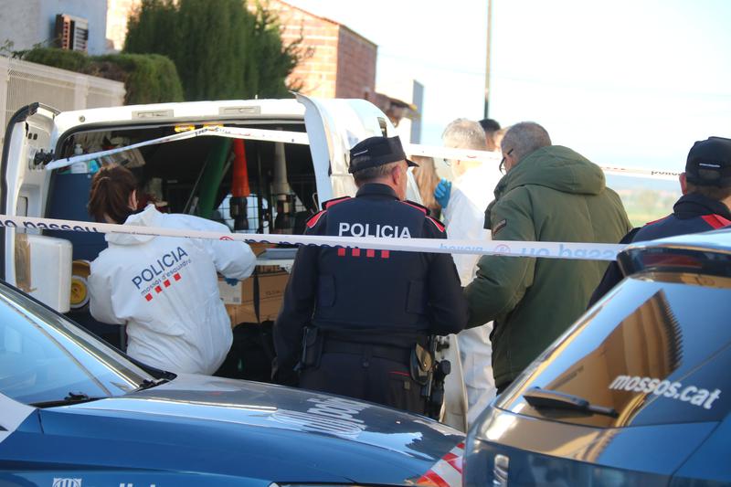 Police working near the crime scene in Bellcaire d'Empordà