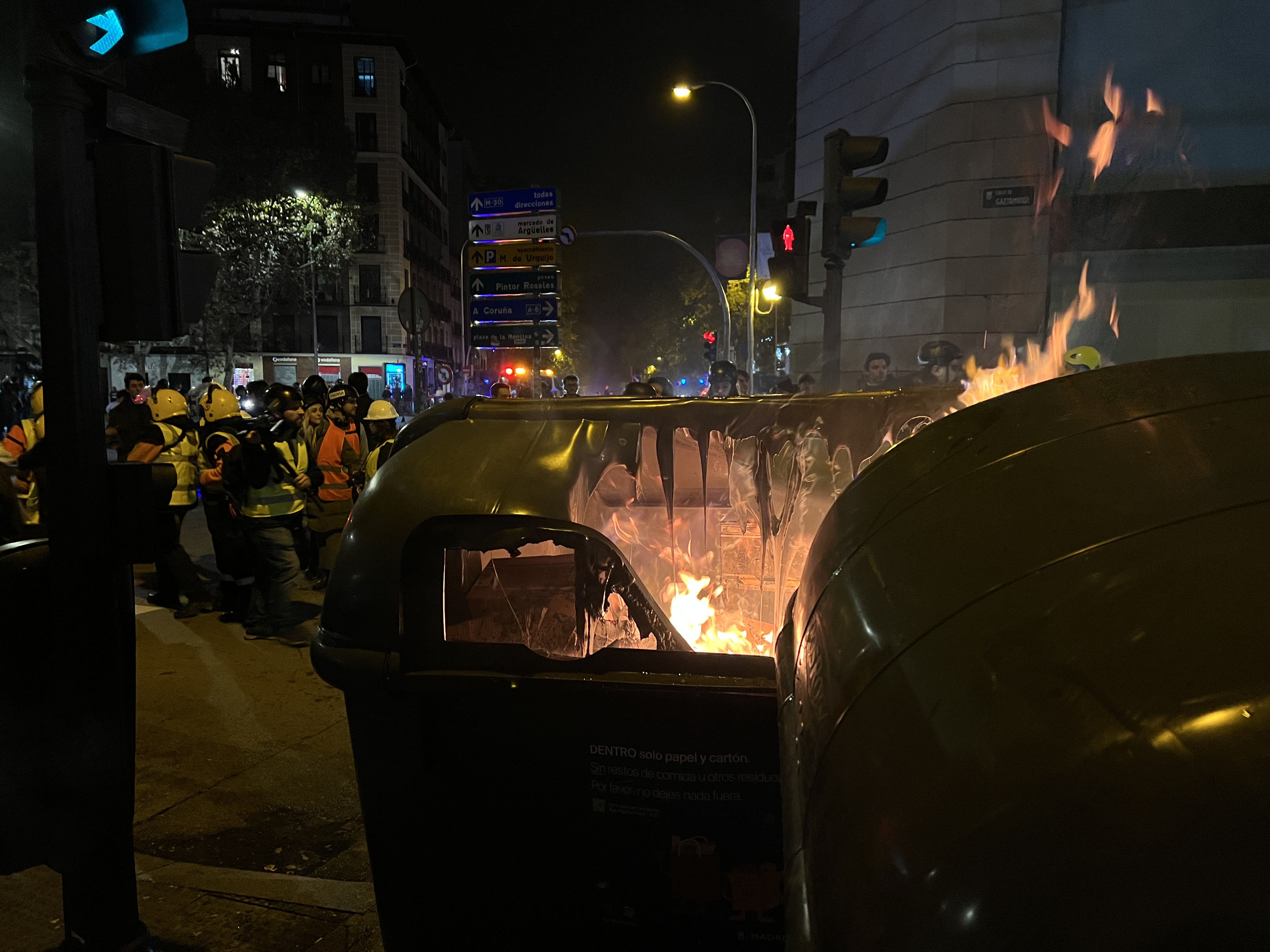 A burning dumpster during the protest