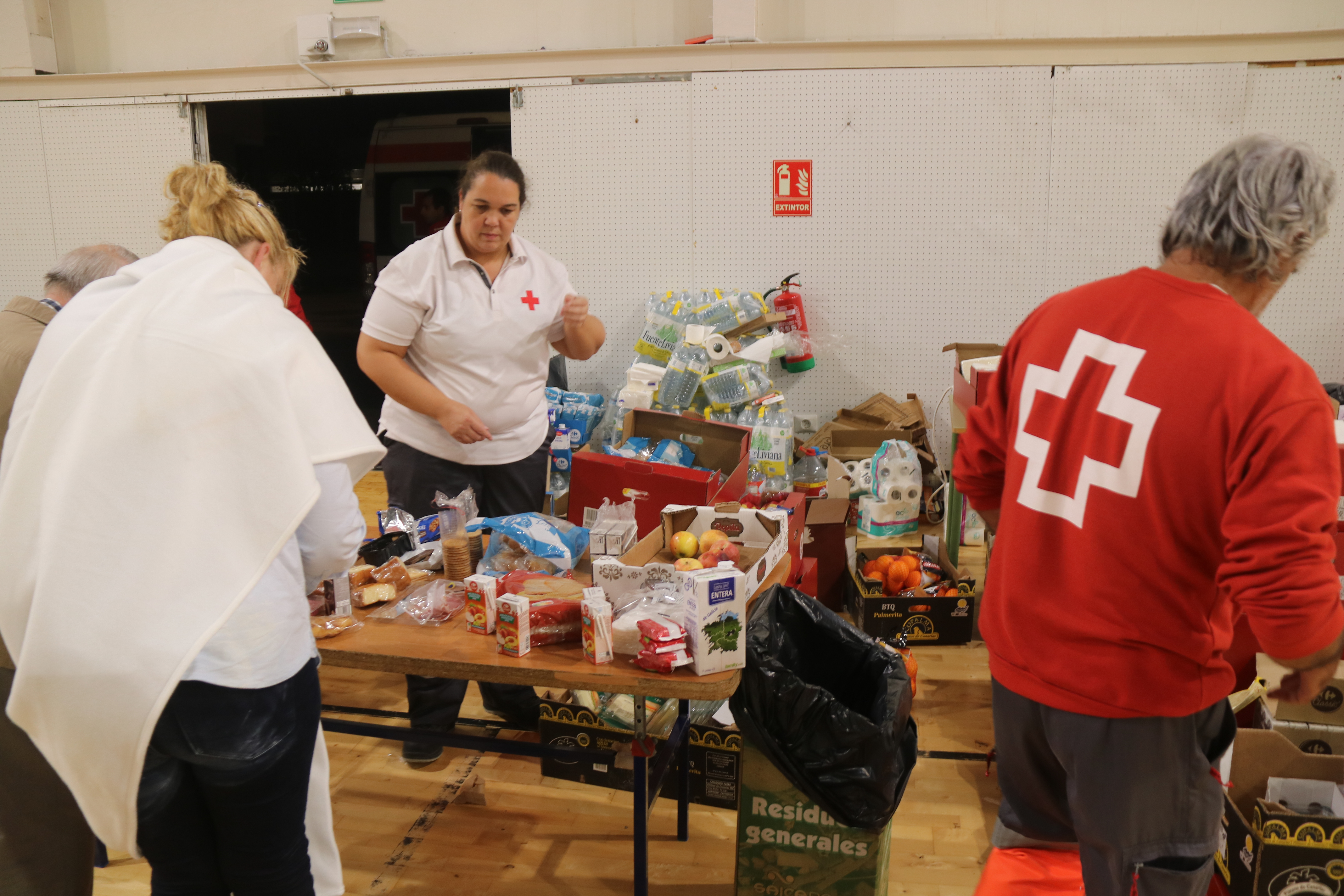 The Red Cross organization gives food to those who spent the night in a sports hall due to severe storm in the Terres de l'Ebre on October 13, 2025