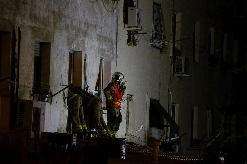 Firefighters looking for victims in the collapsed building in Badalona. 